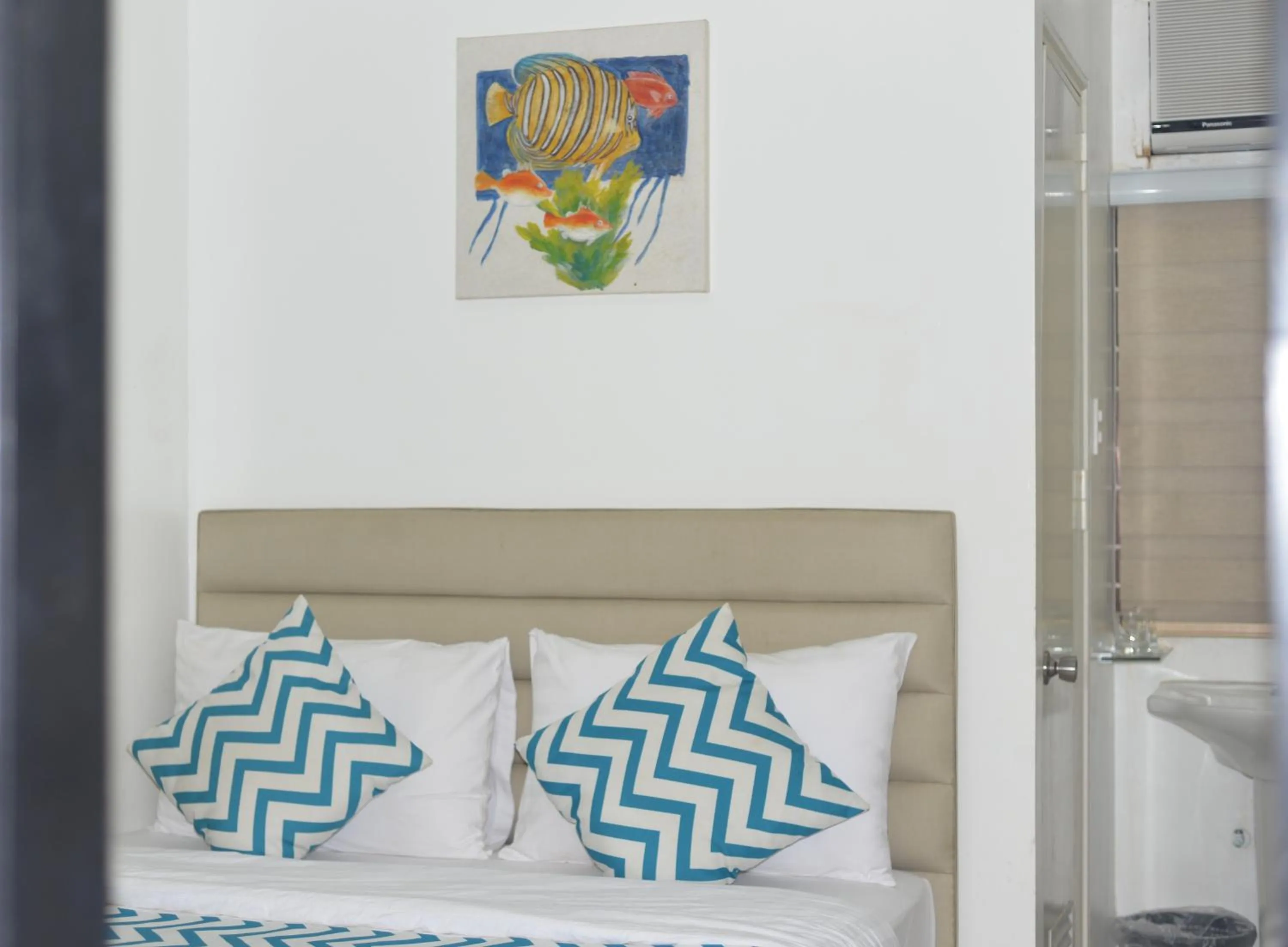 Bed in Grand Blue Beach Hotel