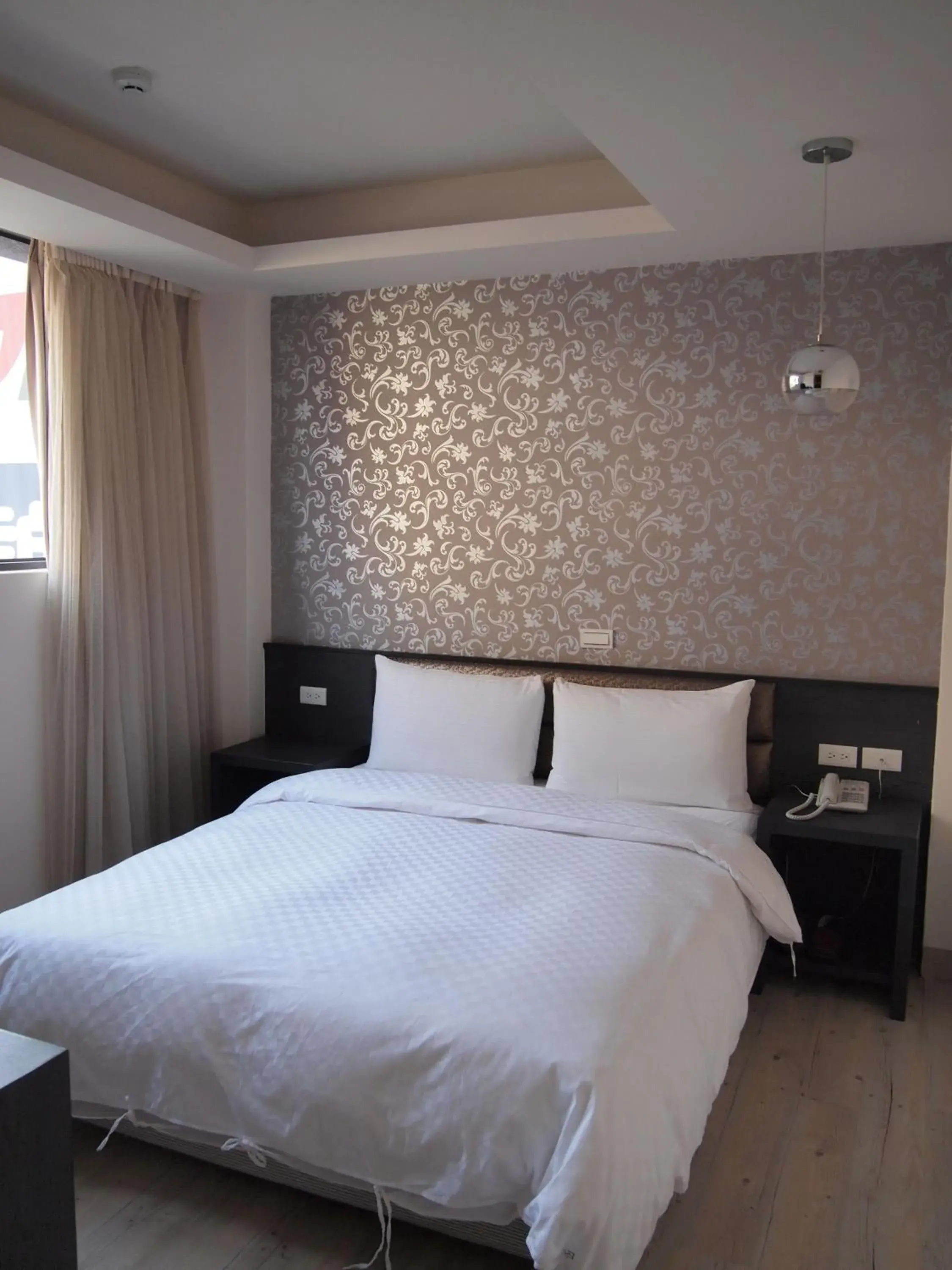 Bed in Jin Bao Hotel