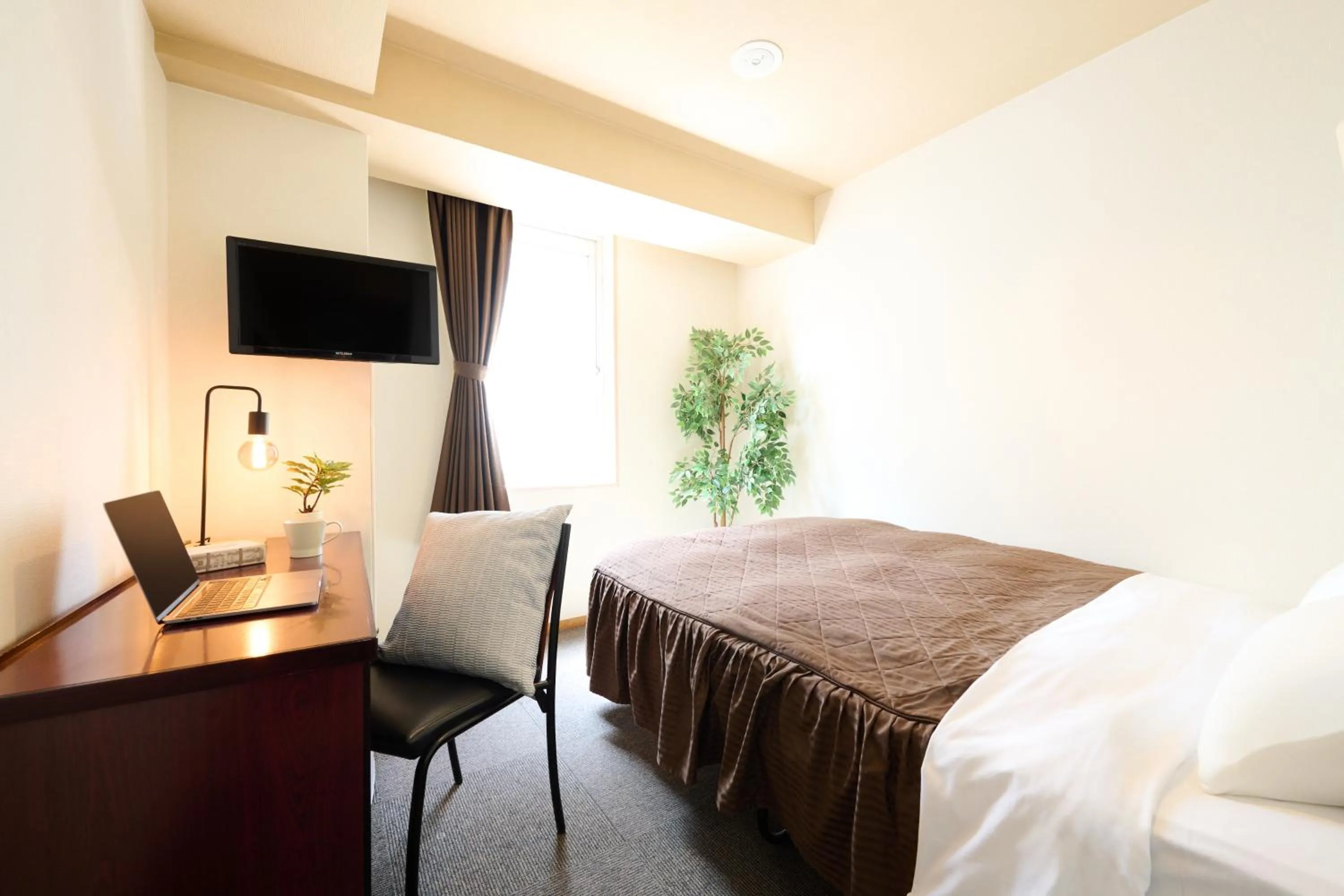 Bed in Hotel Sho Sapporo