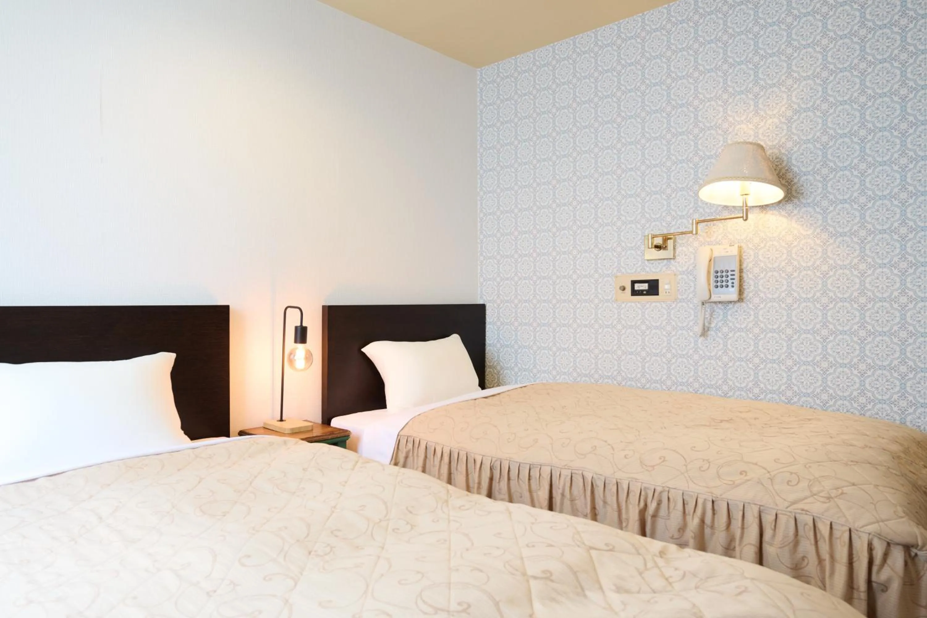 Bed in Hotel Sho Sapporo