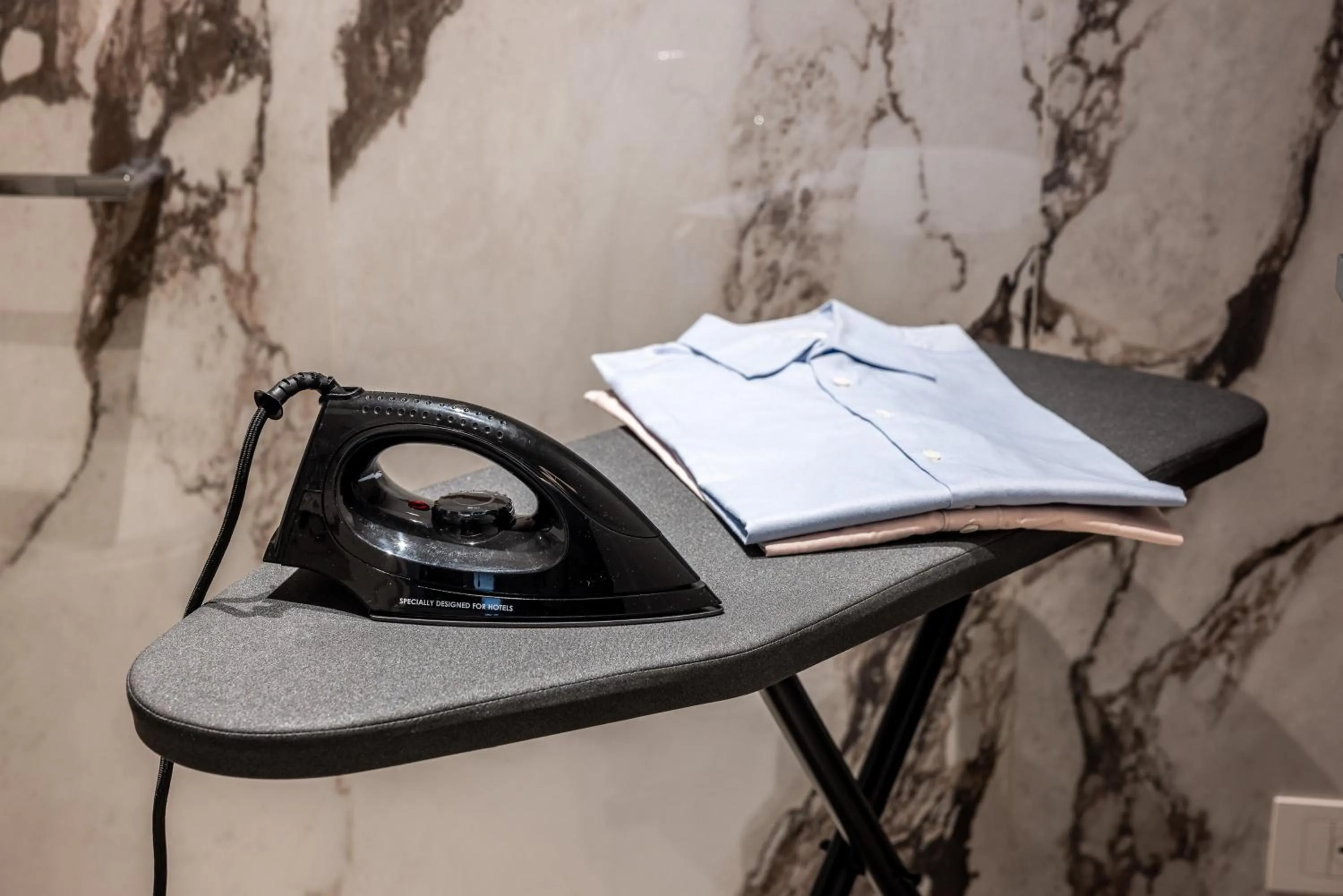 flat iron in Aramis Deluxe Rooms