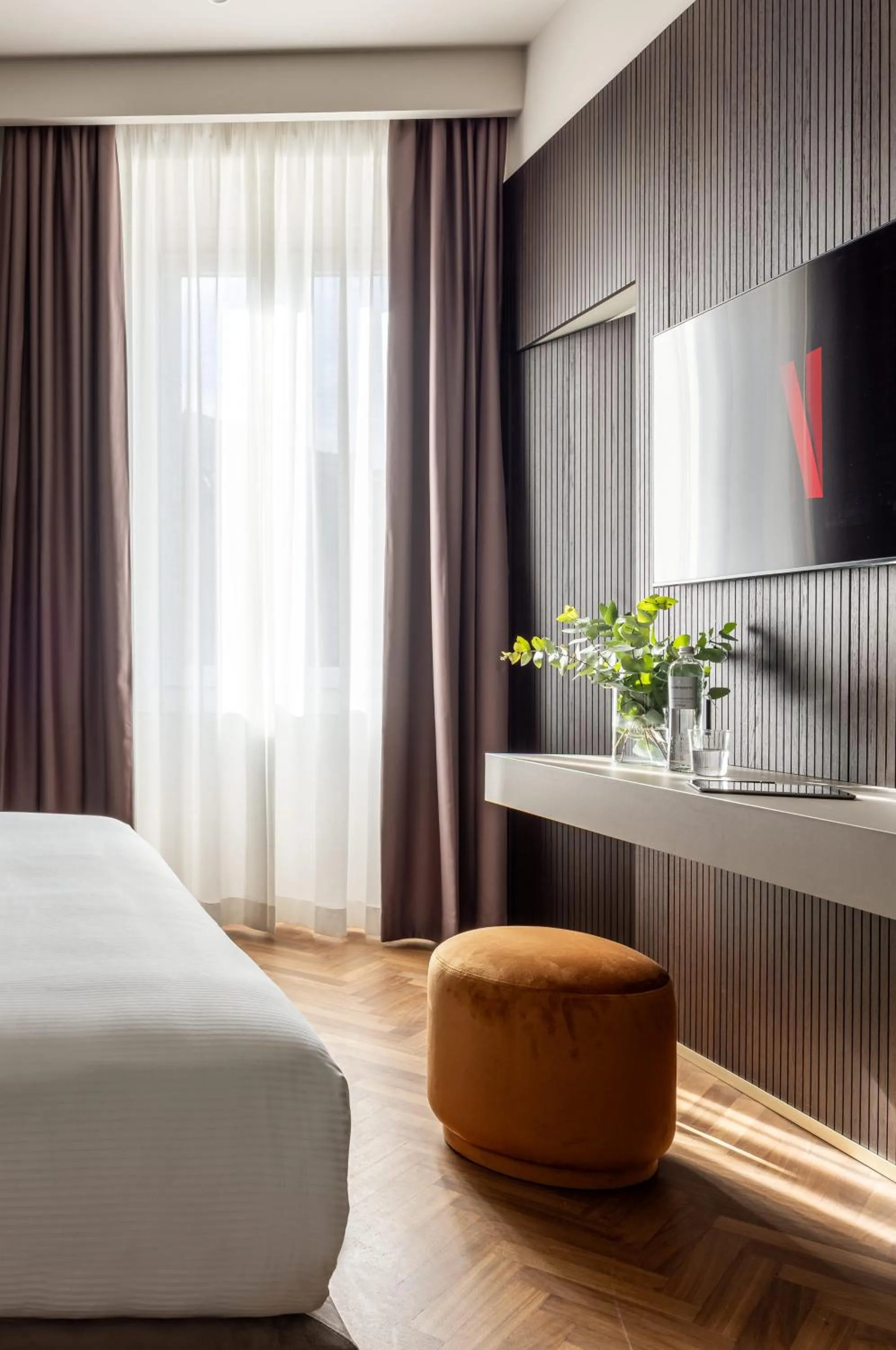 Bed in Aramis Deluxe Rooms