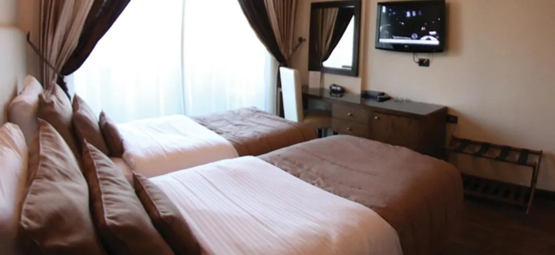 Photo of the whole room, Bed in Royal Garden Hotel