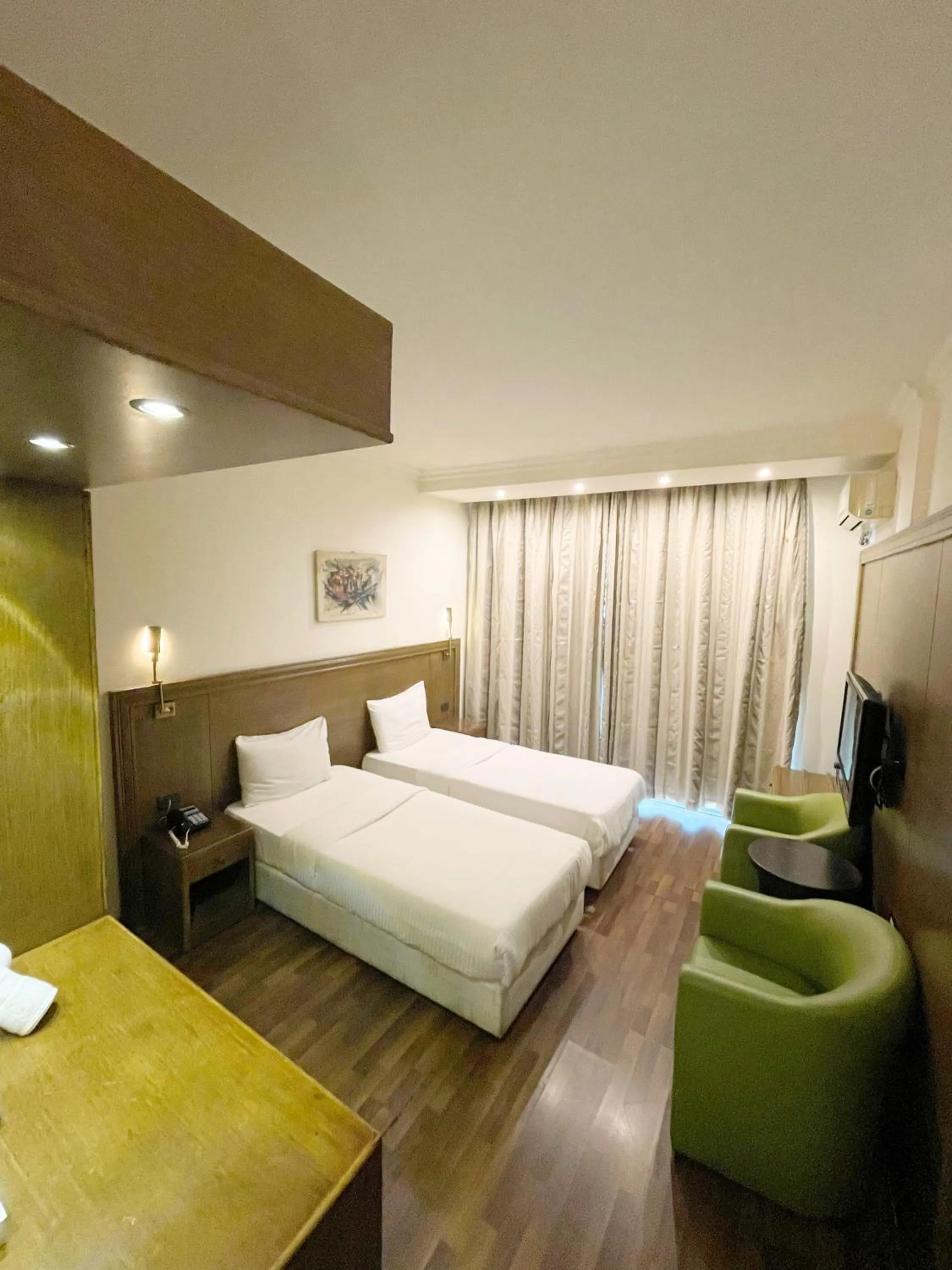 Bed in Royal Garden Hotel