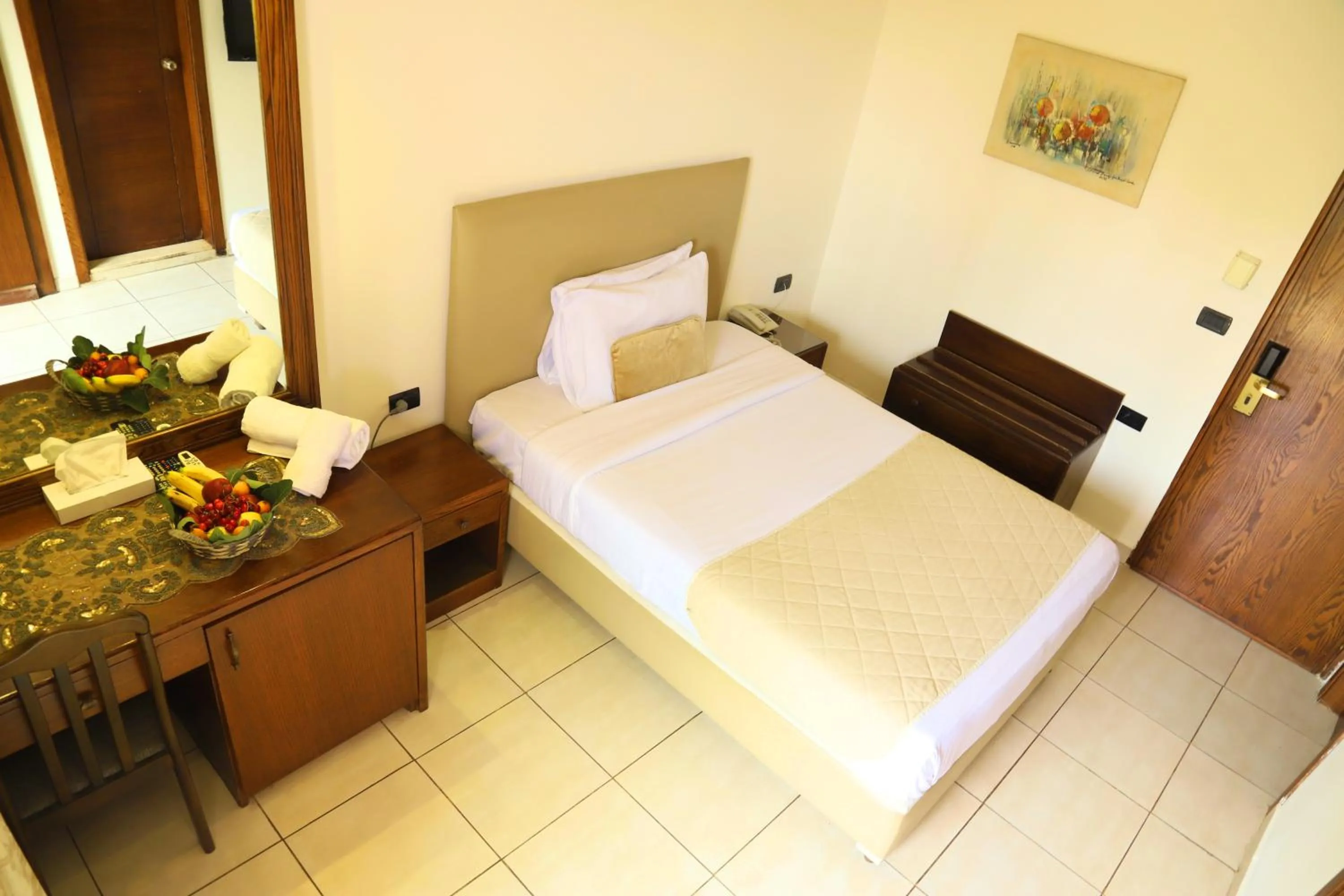 Bed in Royal Garden Hotel