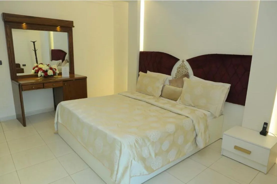 Bed in Royal Garden Hotel