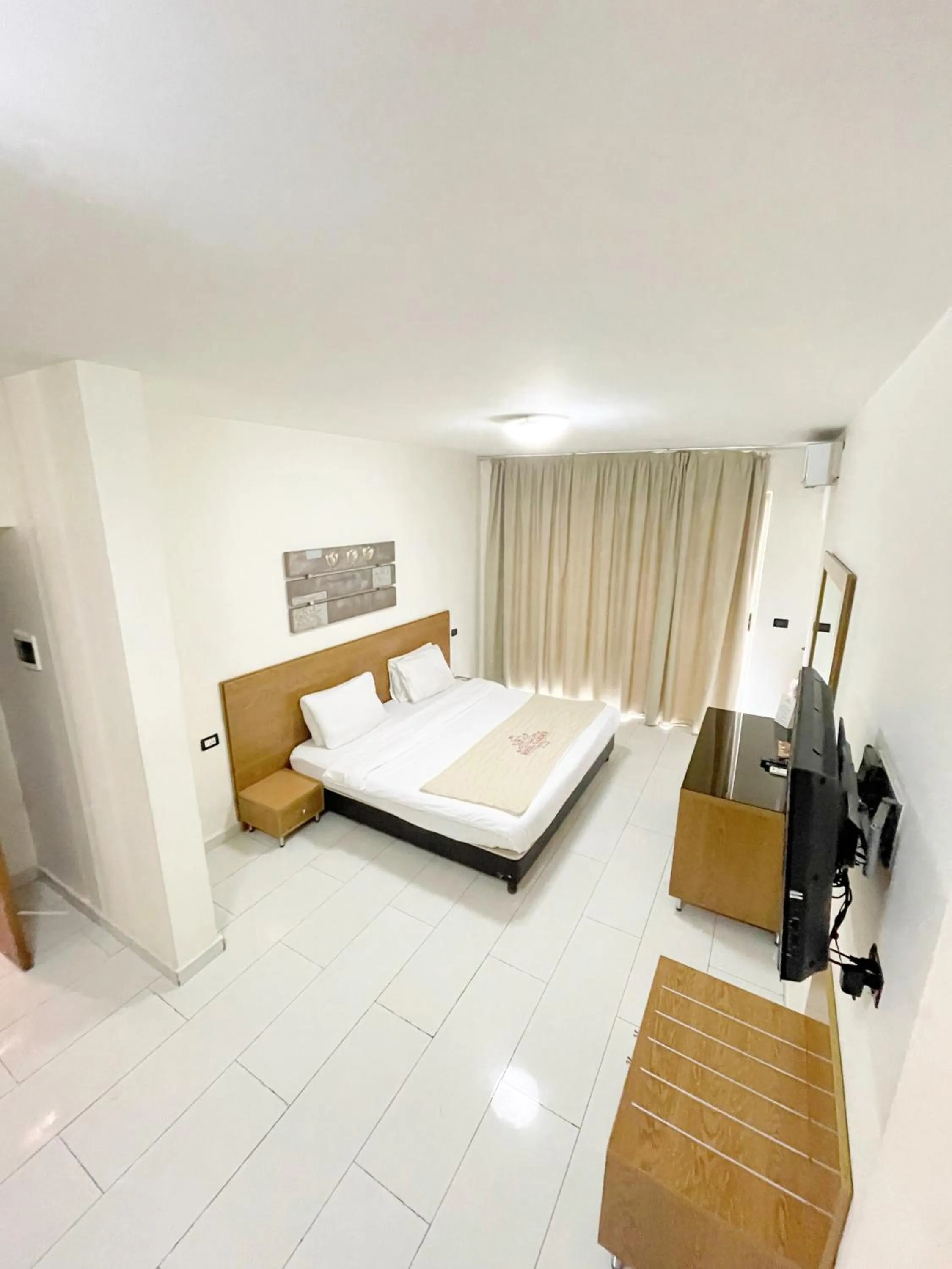 Bed in Royal Garden Hotel