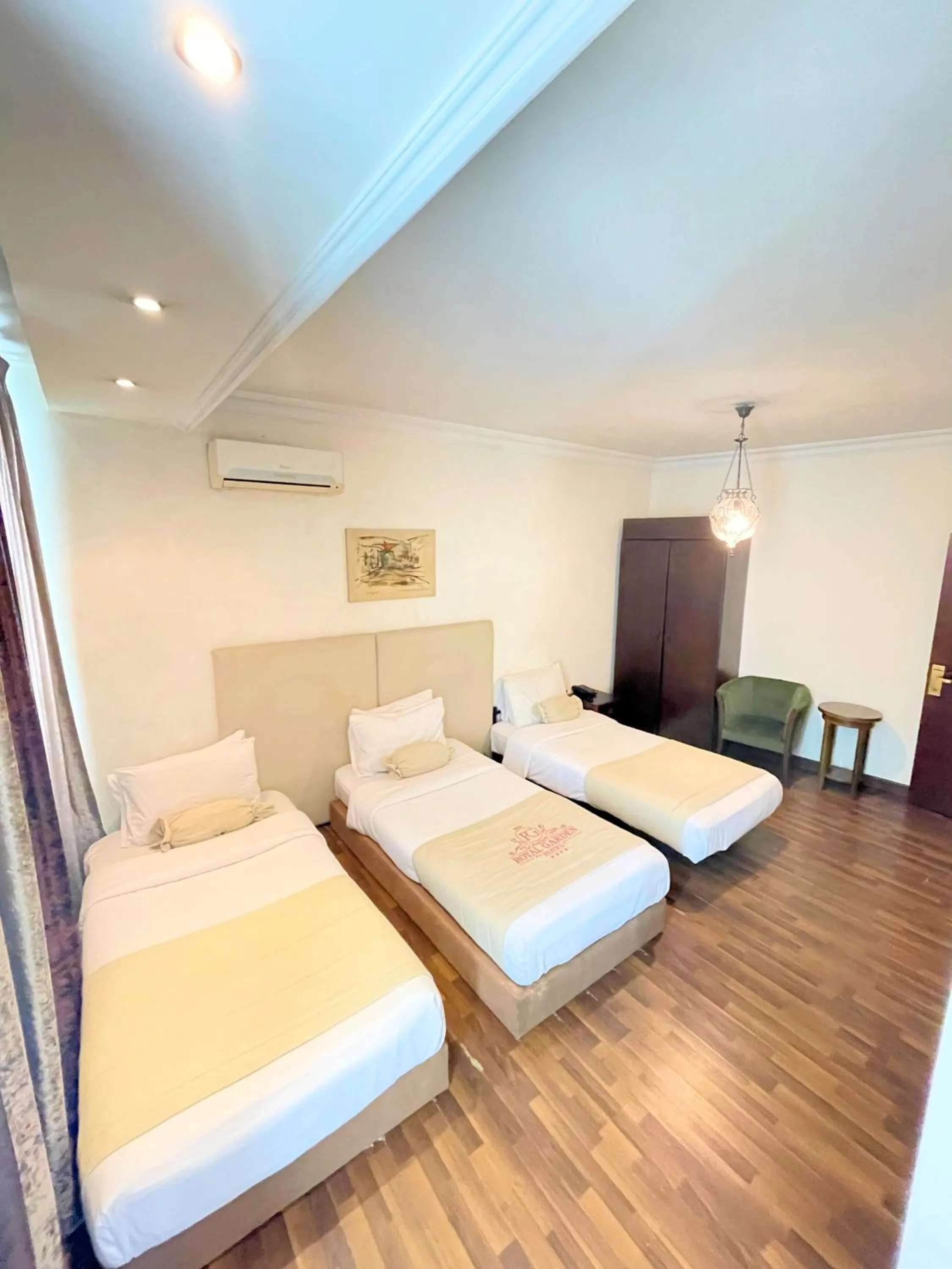 Bed in Royal Garden Hotel