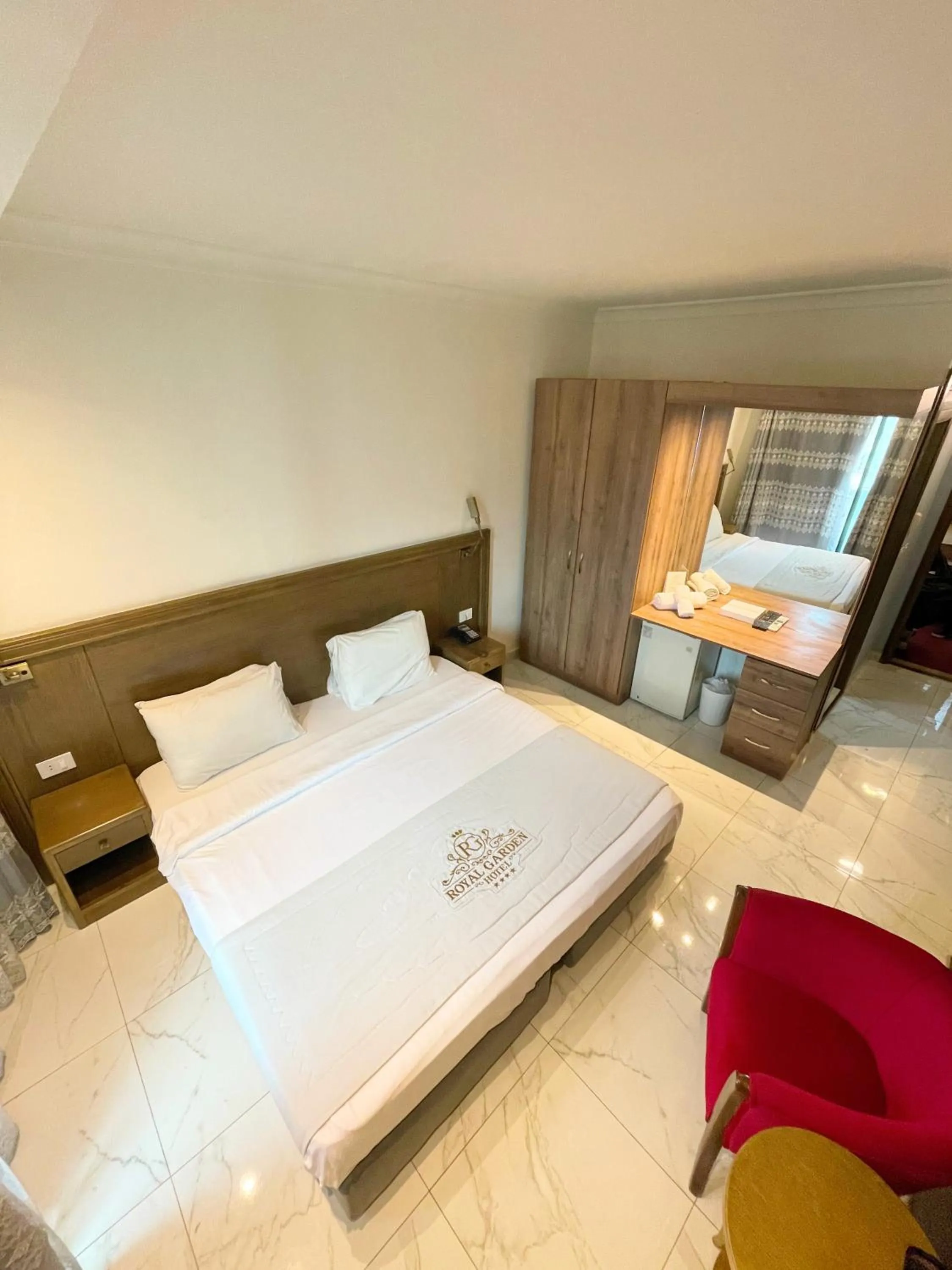 Bed in Royal Garden Hotel