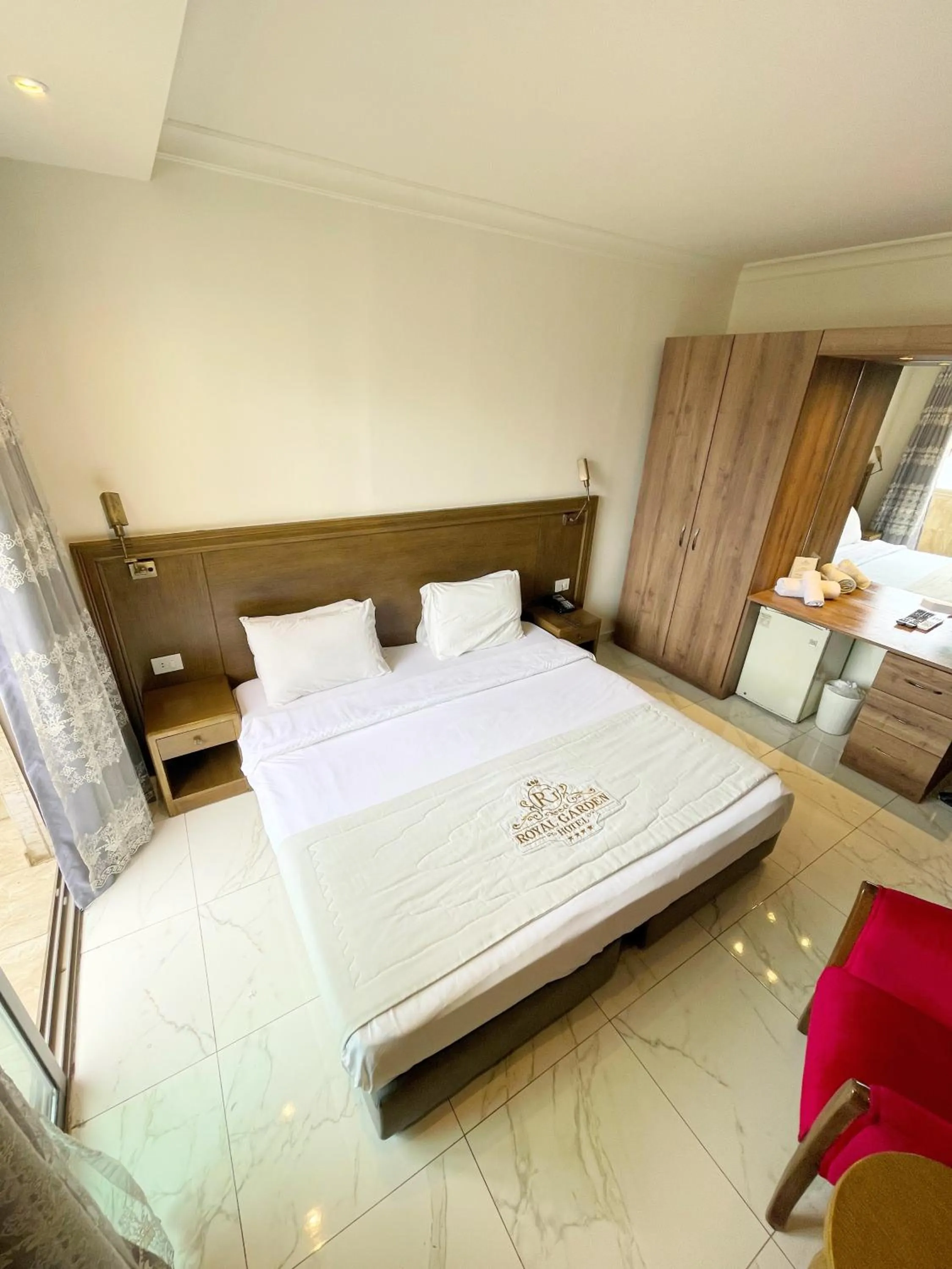 Bed in Royal Garden Hotel