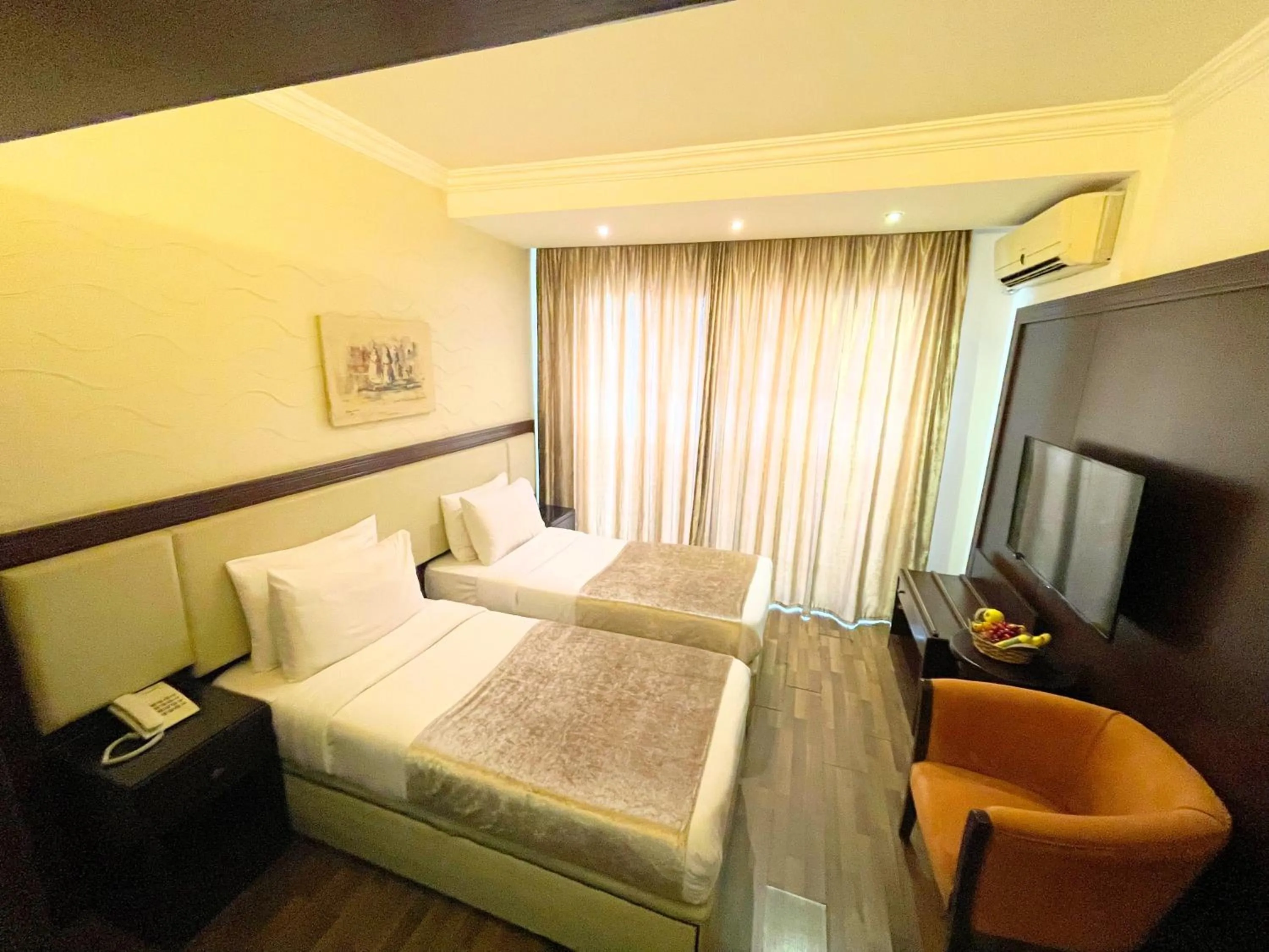 Bed in Royal Garden Hotel