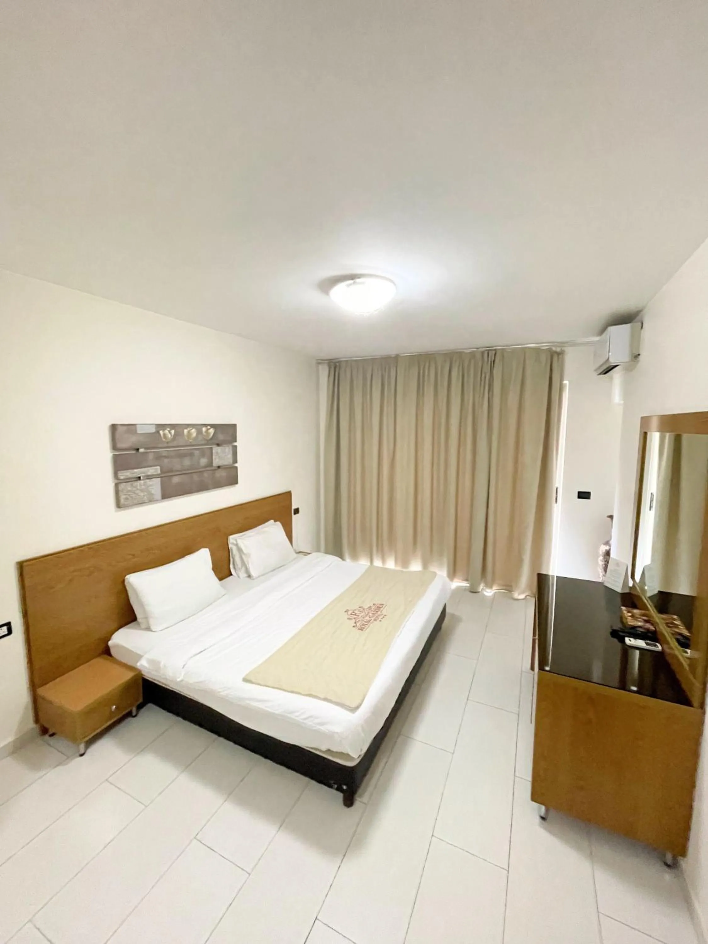 Bed in Royal Garden Hotel