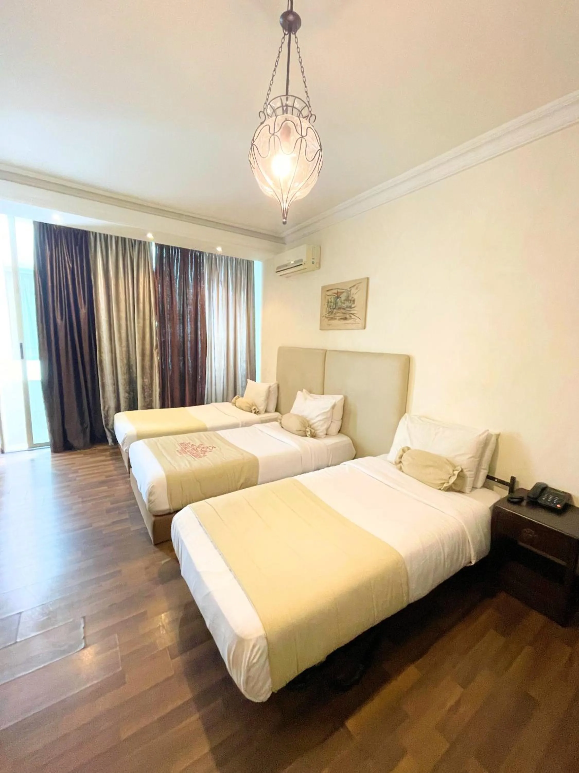 Bed in Royal Garden Hotel