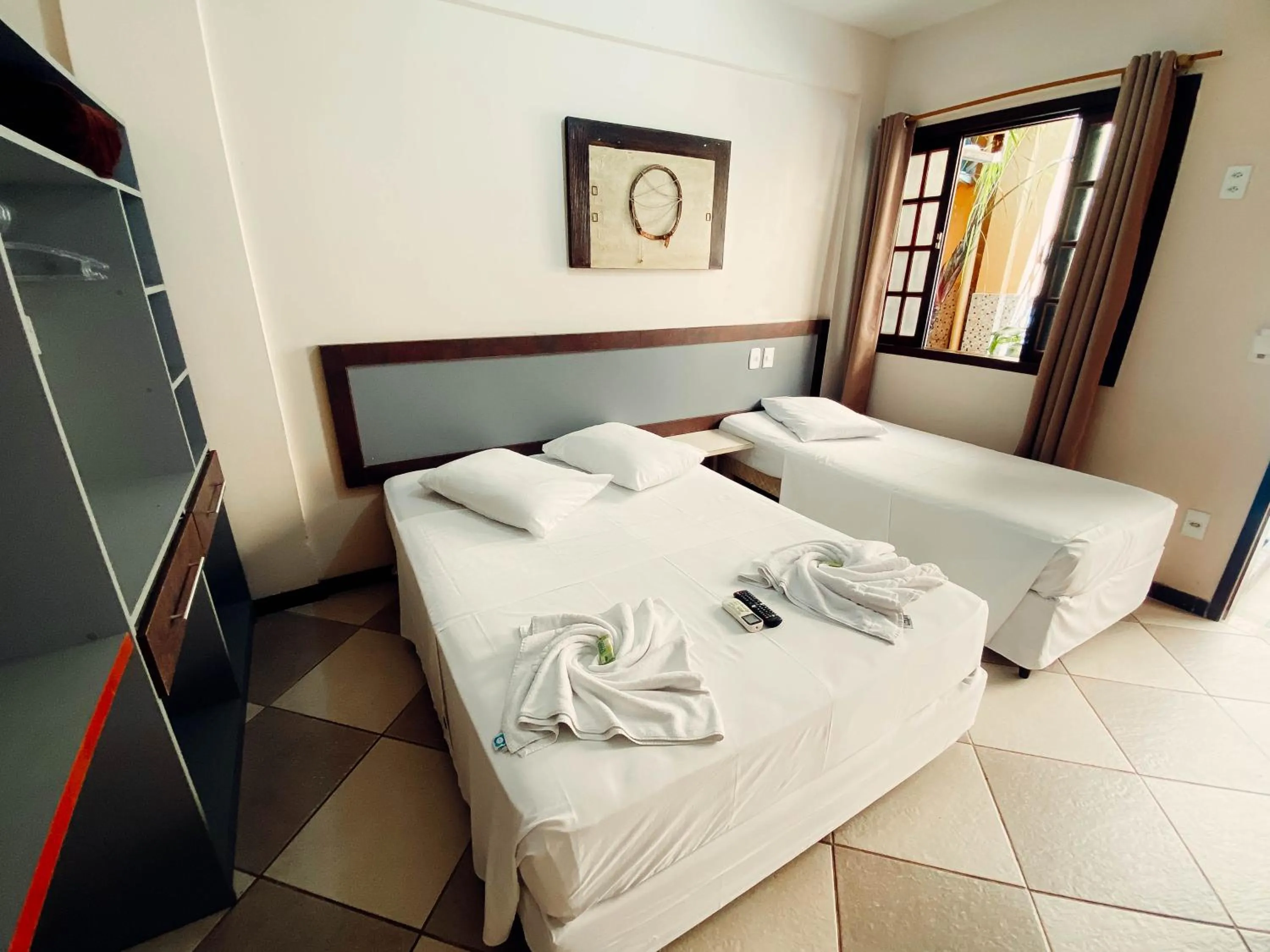 Bed in Lonier Praia Inn Flats