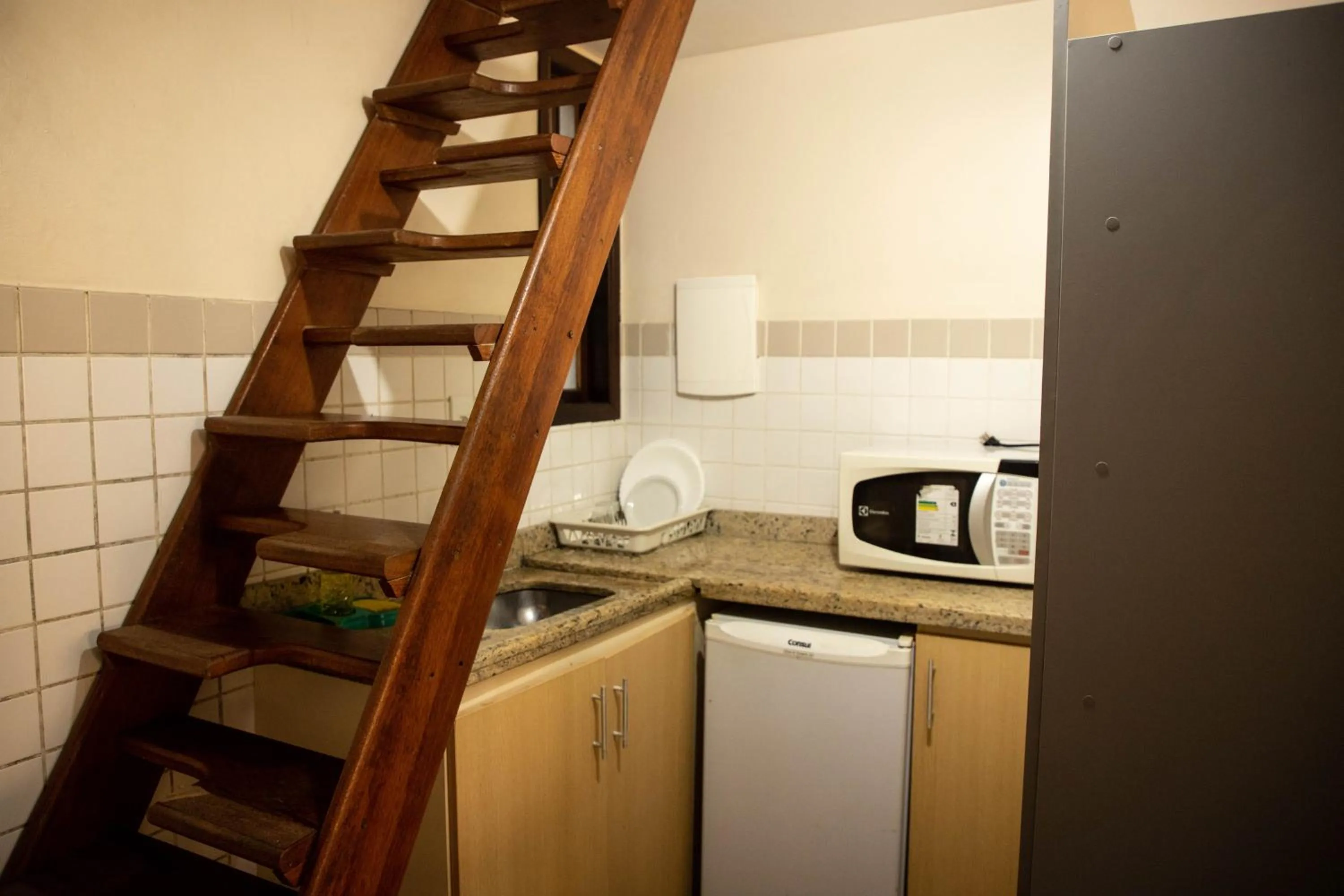 Kitchen or kitchenette in Lonier Praia Inn Flats