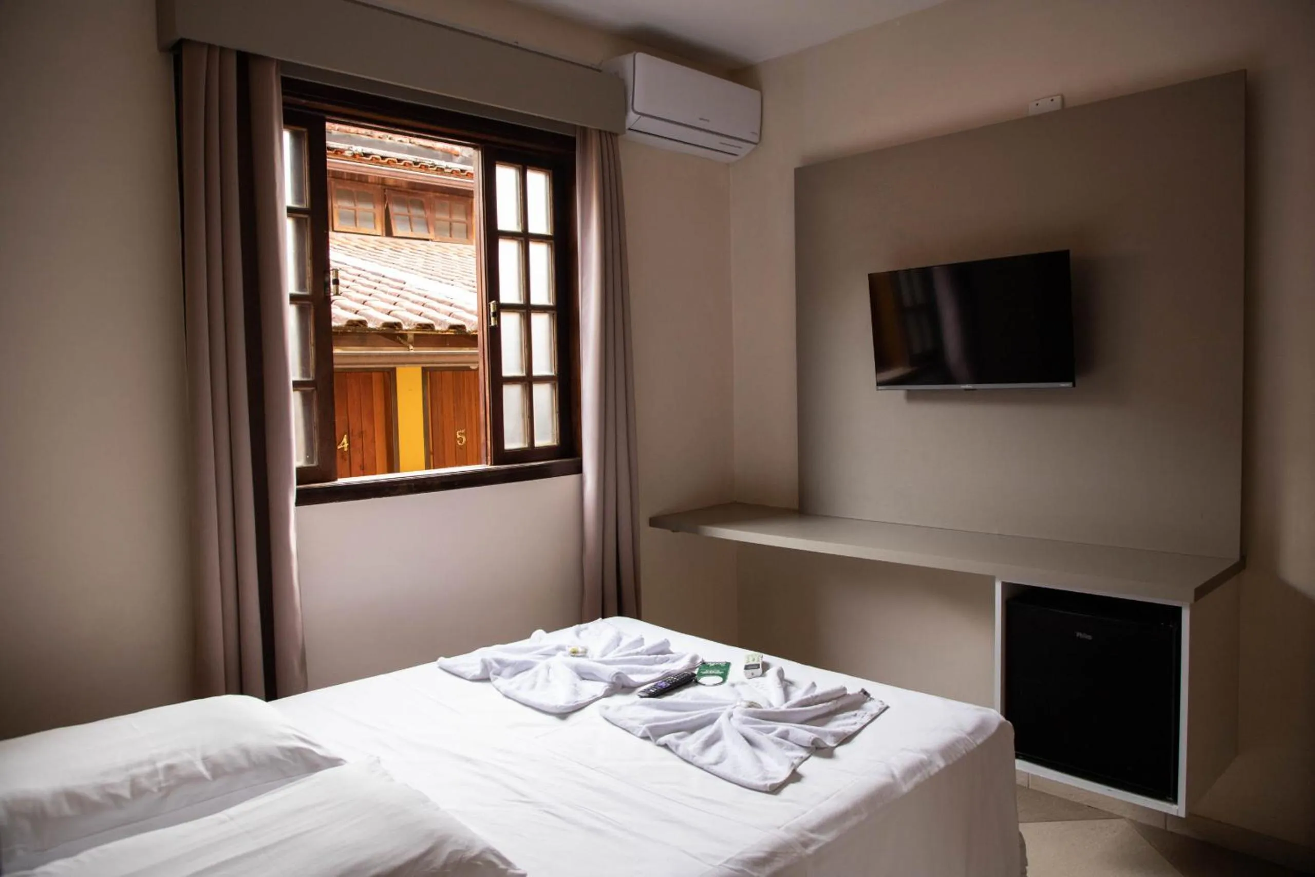 Bed in Lonier Praia Inn Flats