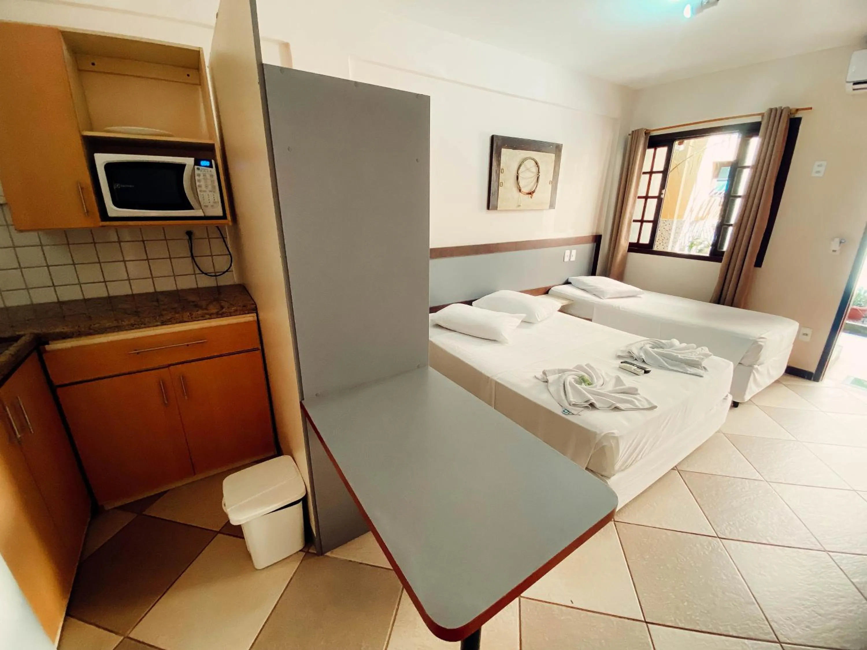 Bed in Lonier Praia Inn Flats