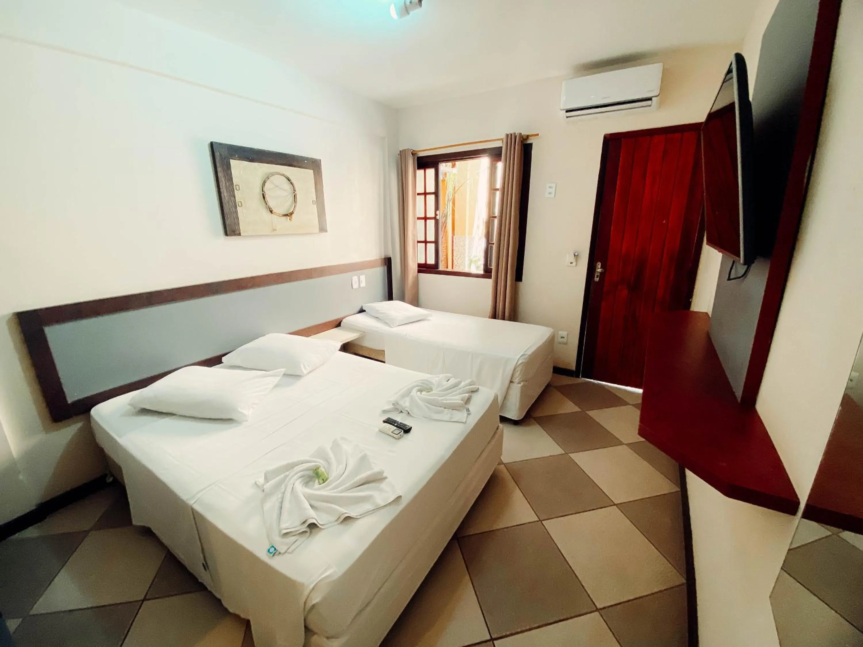 Bed in Lonier Praia Inn Flats