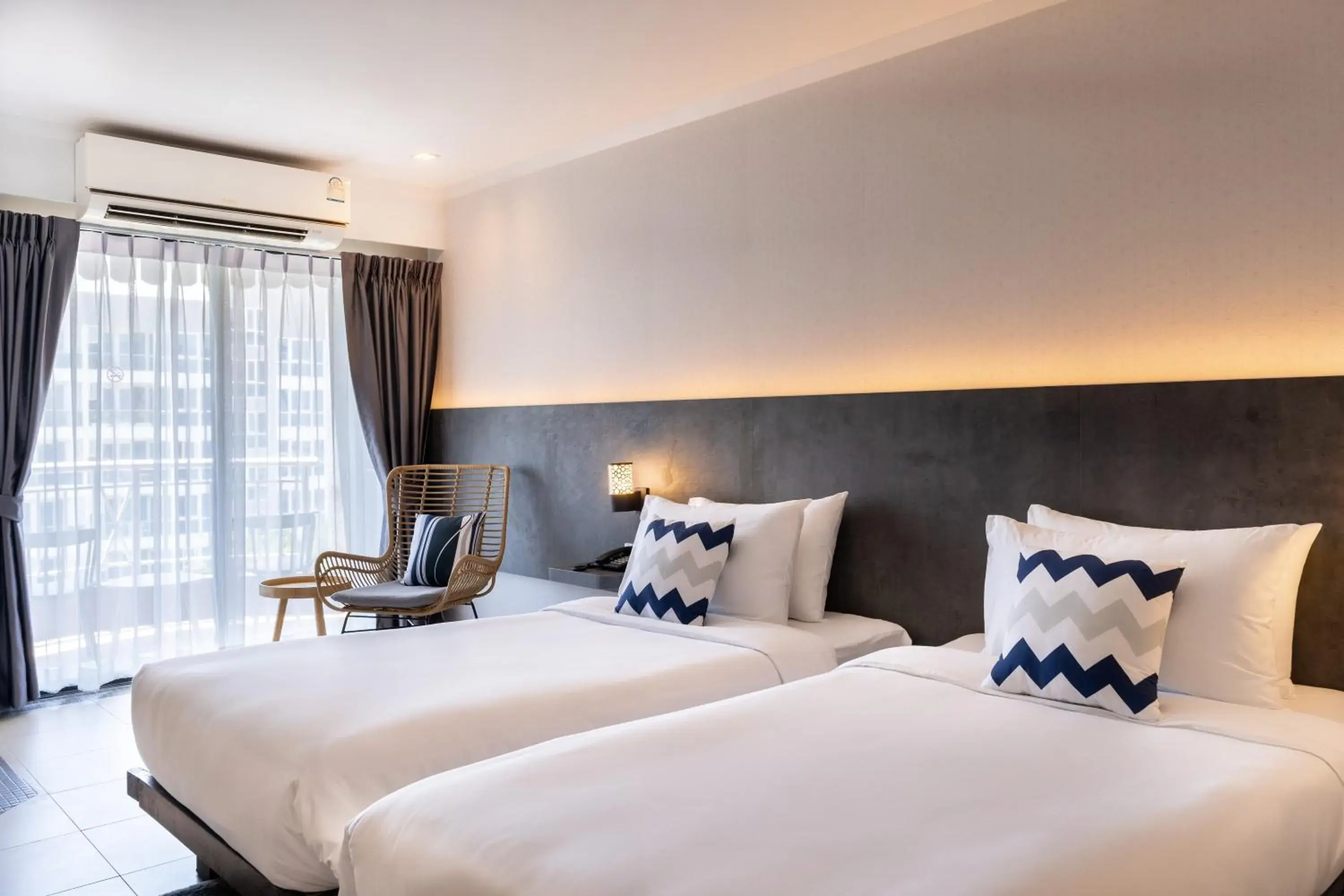 Deluxe Twin Room with Balcony in Heeton Concept Hotel Pattaya by Compass Hospitality Deluxe Twin Room with Balcony in Heeton Concept Hotel Pattaya by Compass Hospitality