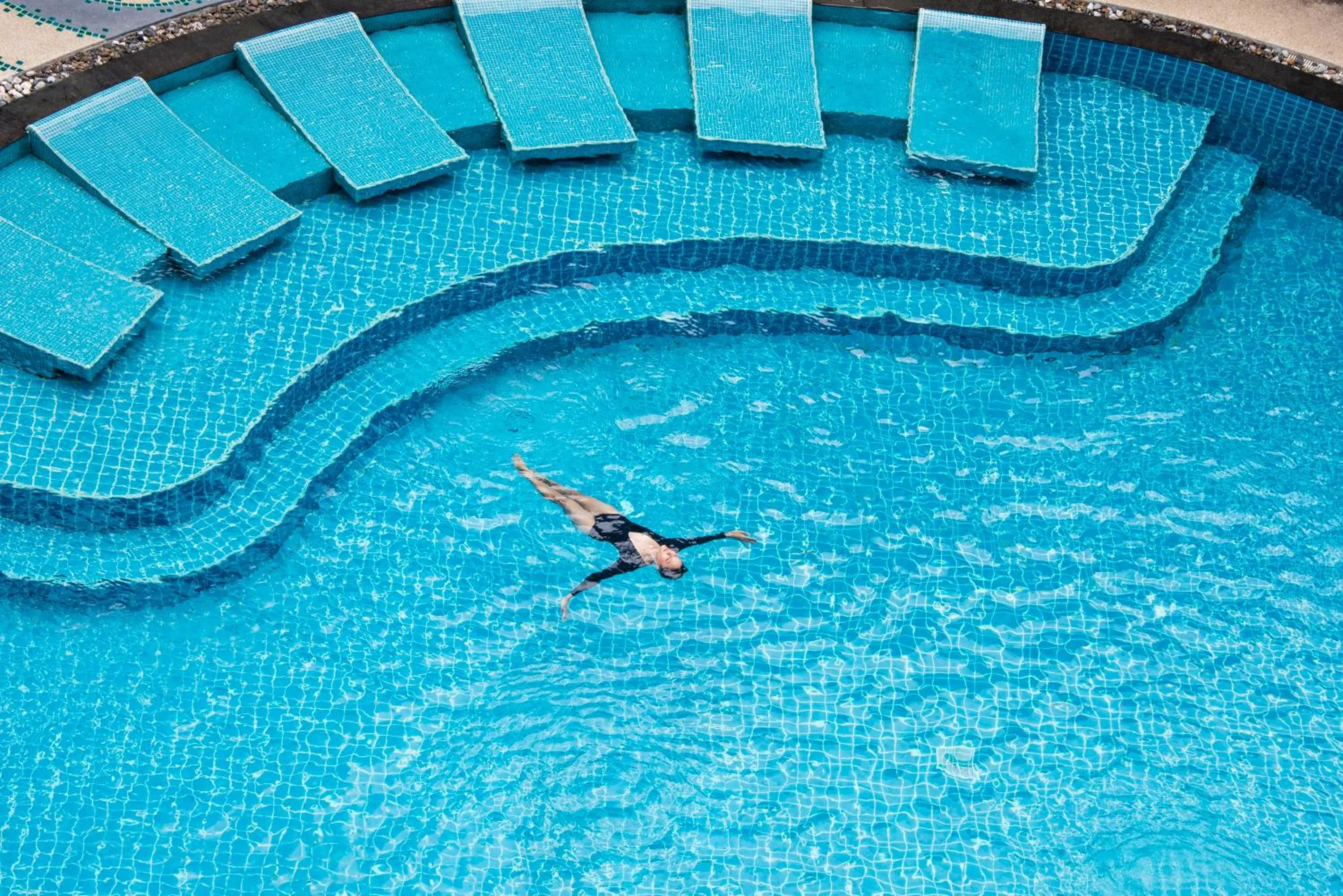 Swimming pool in Heeton Concept Hotel Pattaya by Compass Hospitality