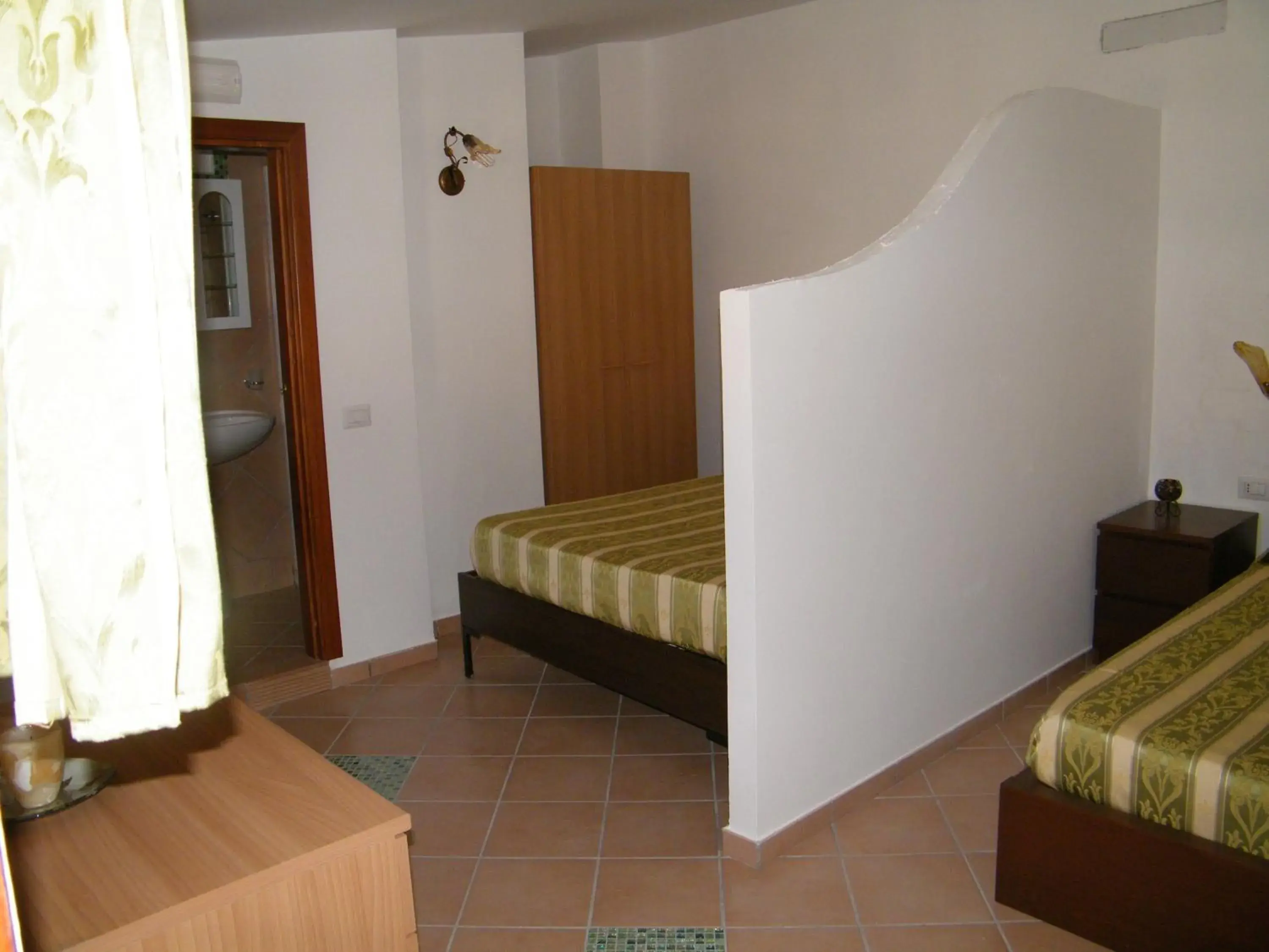 Quadruple Room in Hotel Villaggio Tabù Quadruple Room in Hotel Villaggio Tabù