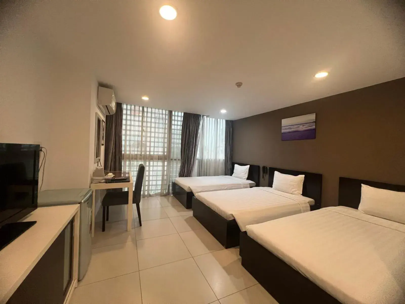 Deluxe Triple Room in Minh Khang Hotel Deluxe Triple Room in Minh Khang Hotel