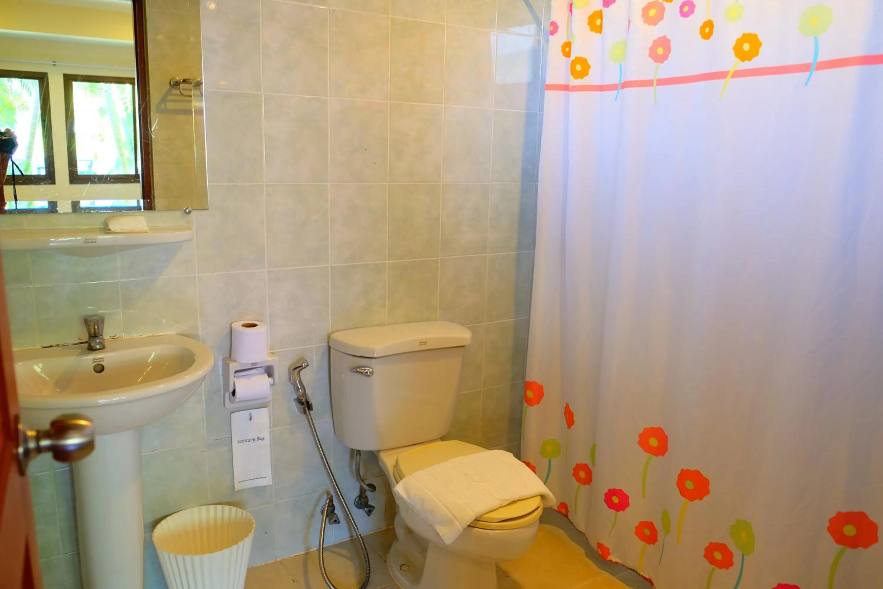 Bathroom in New Travel Beach Hotel & Resort