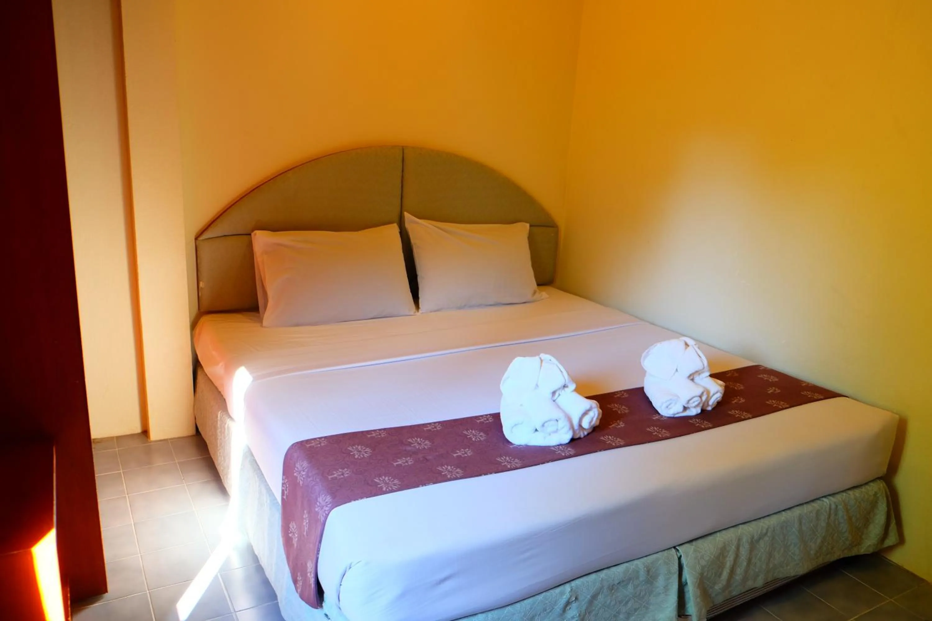 Bed in New Travel Beach Hotel & Resort