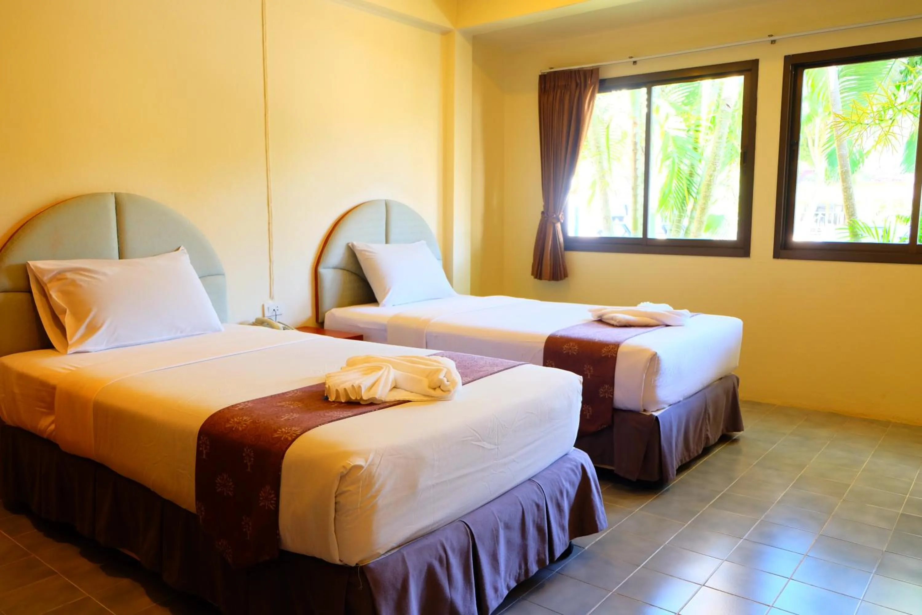 Bed in New Travel Beach Hotel & Resort