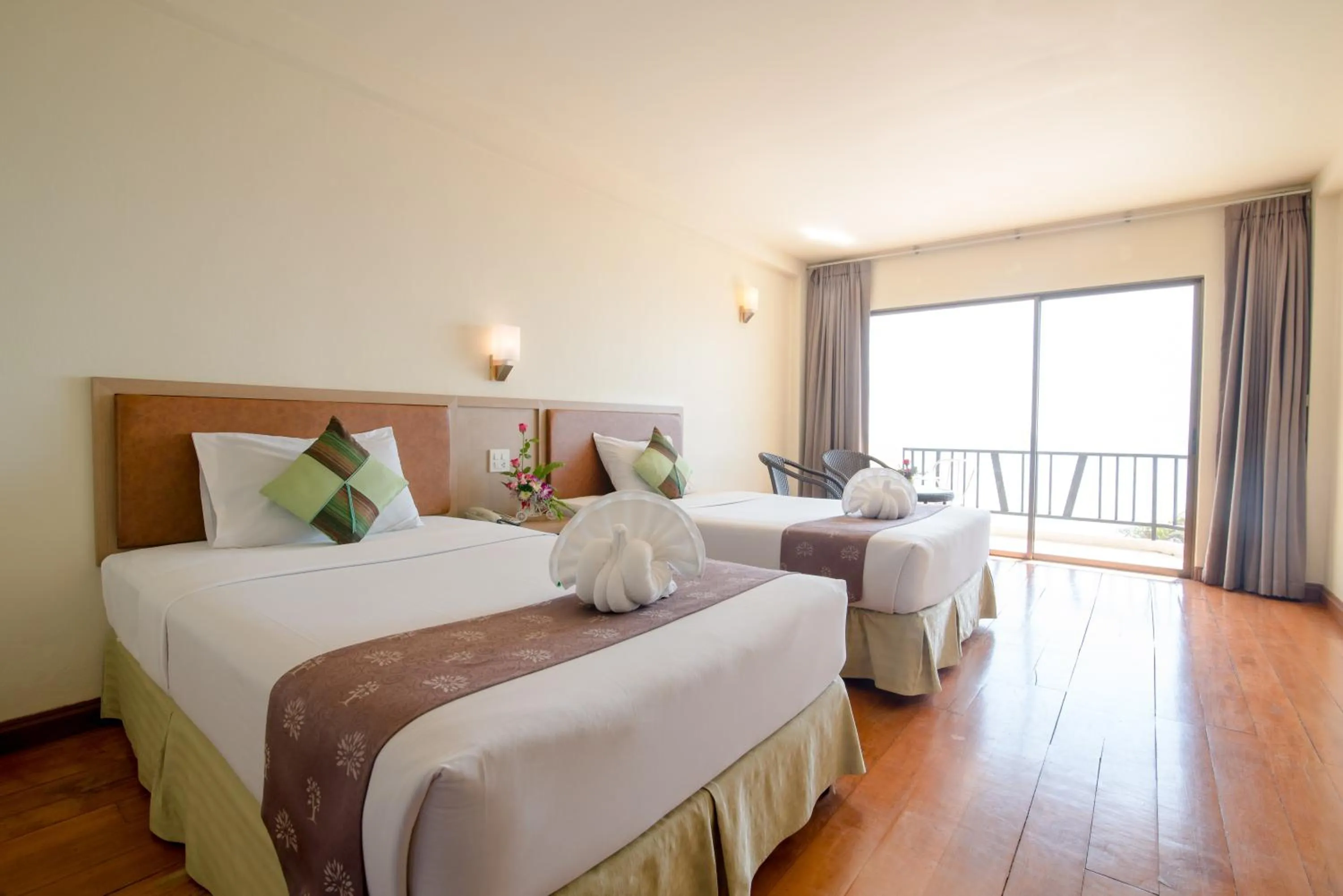 Bed in New Travel Beach Hotel & Resort