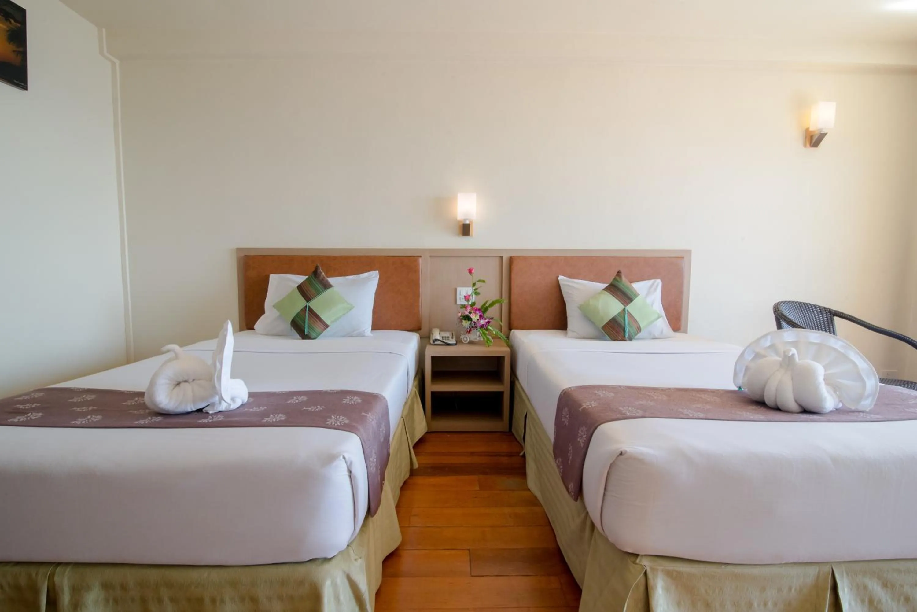 Bed in New Travel Beach Hotel & Resort