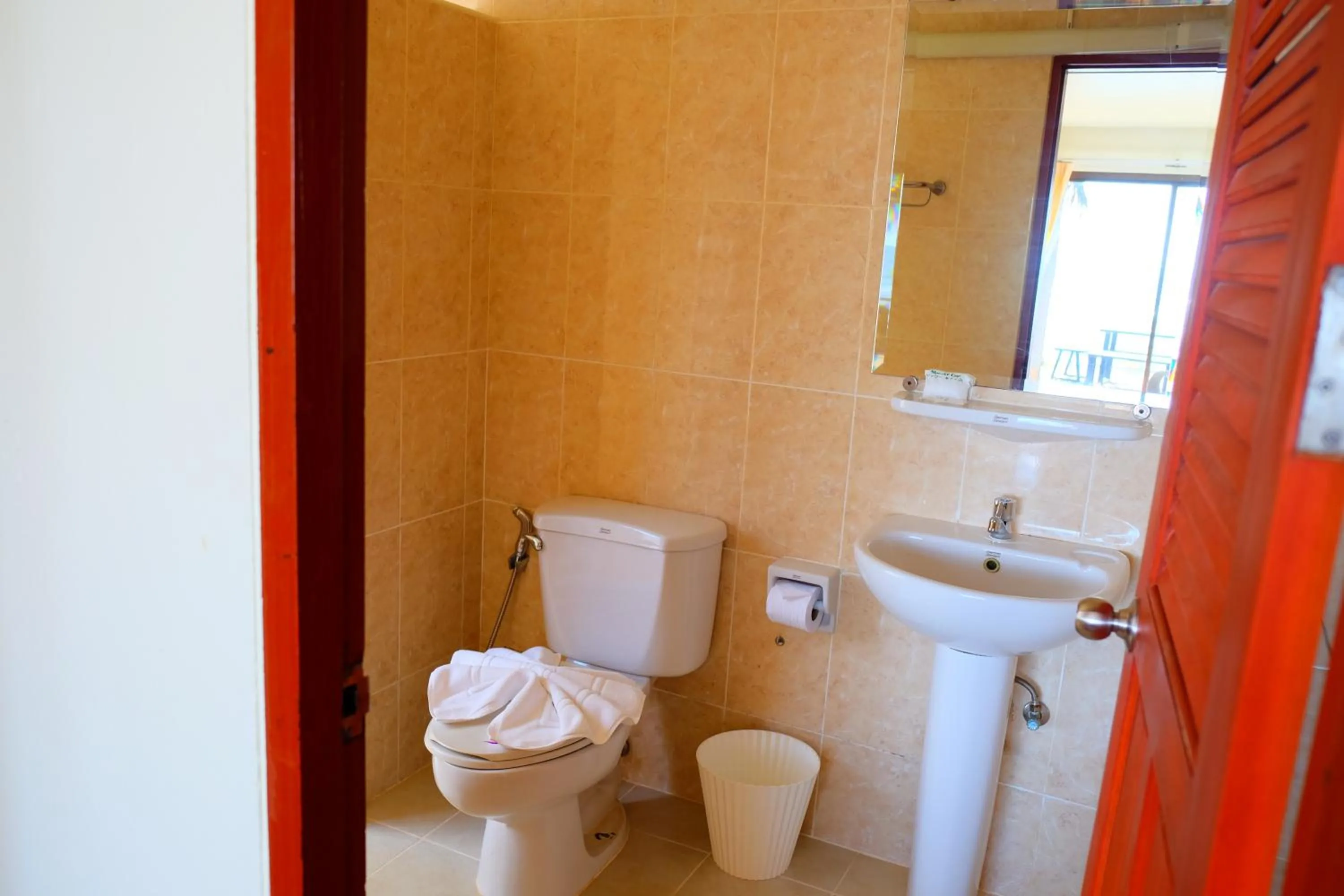 Bathroom in New Travel Beach Hotel & Resort