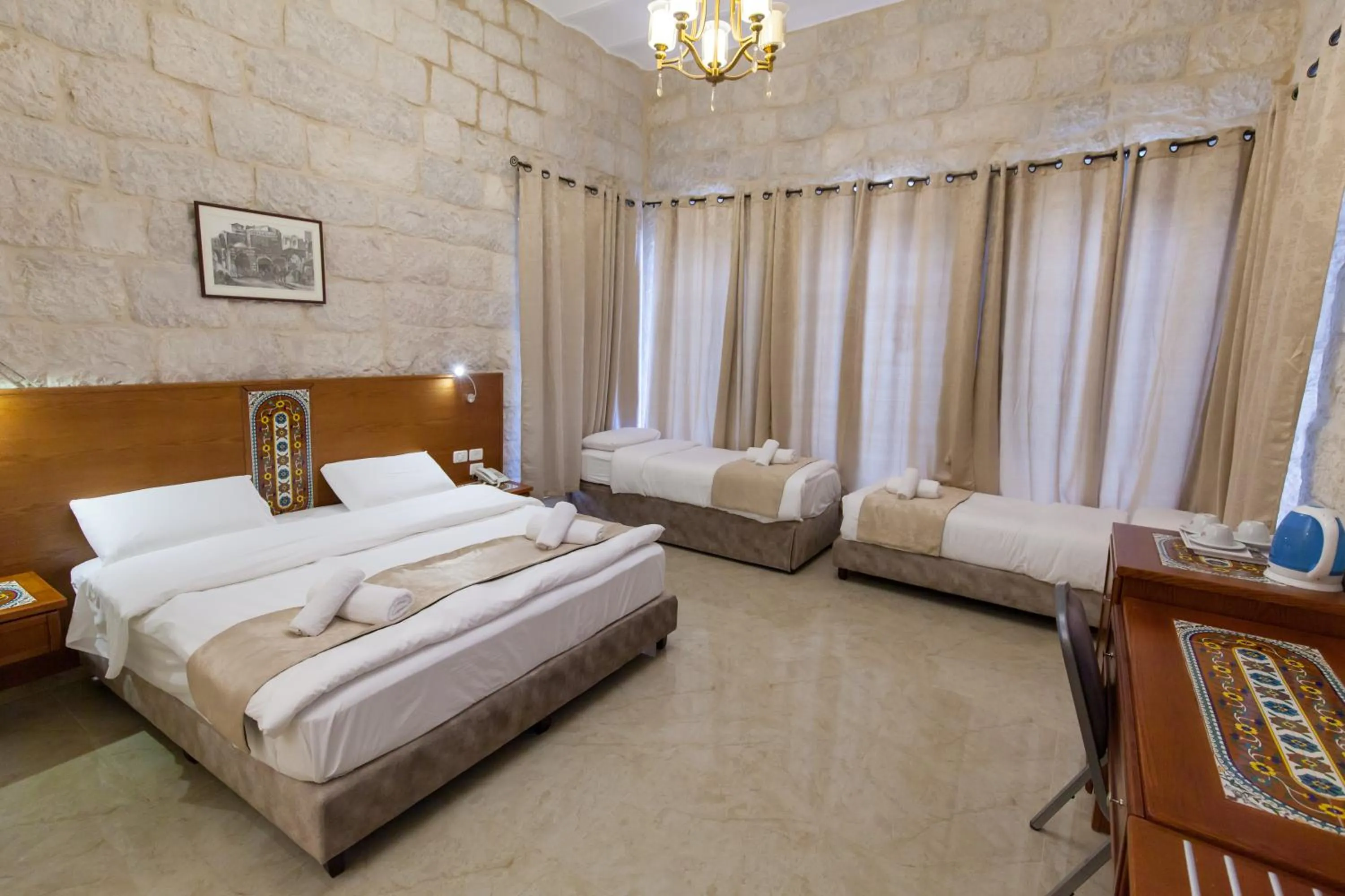 Photo of the whole room, Bed in Azzahra Boutique Hotel & Restaurant - Jerusalem
