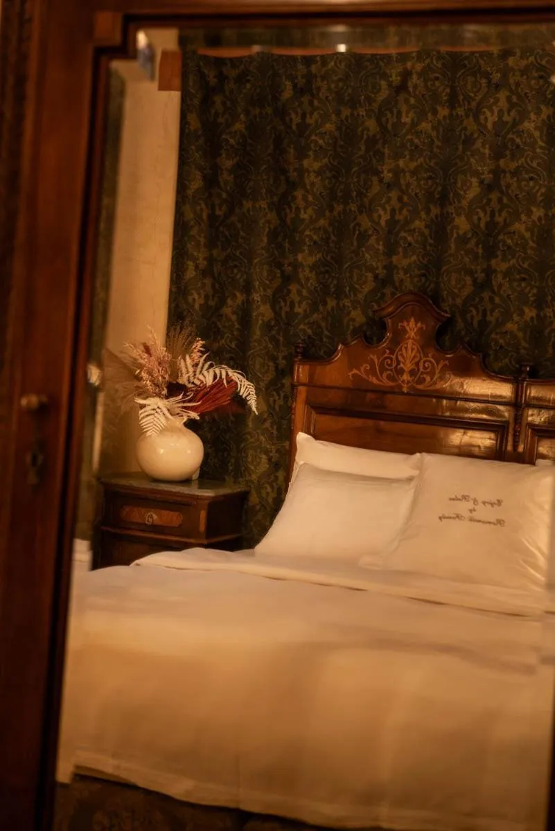 Bed in Novecento Boutique Hotel
