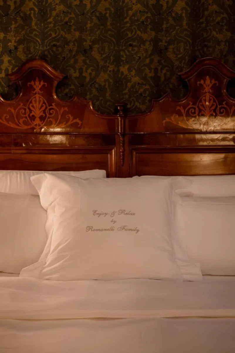 Bed in Novecento Boutique Hotel