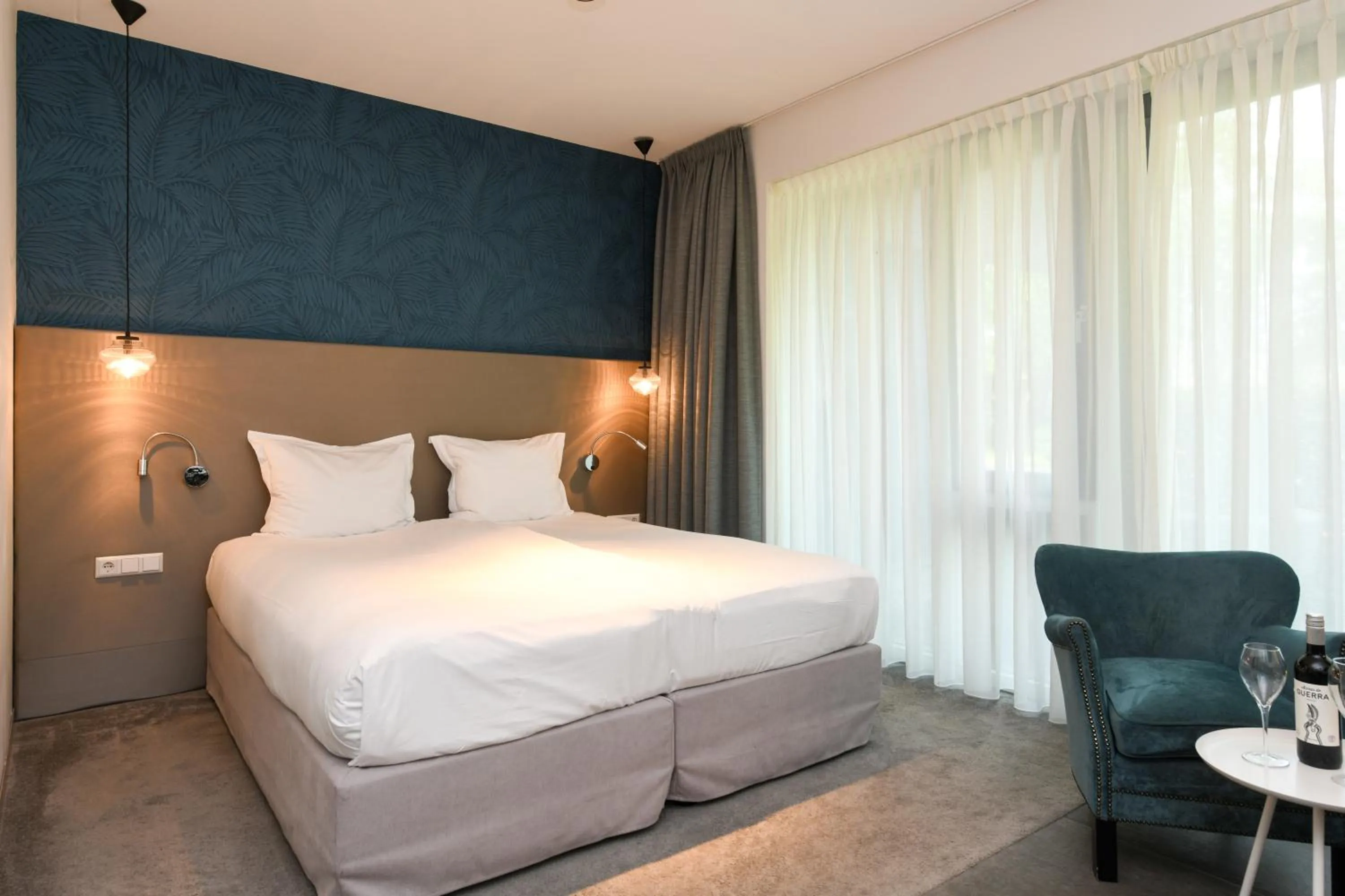 Bed in Hotel De Roode Schuur