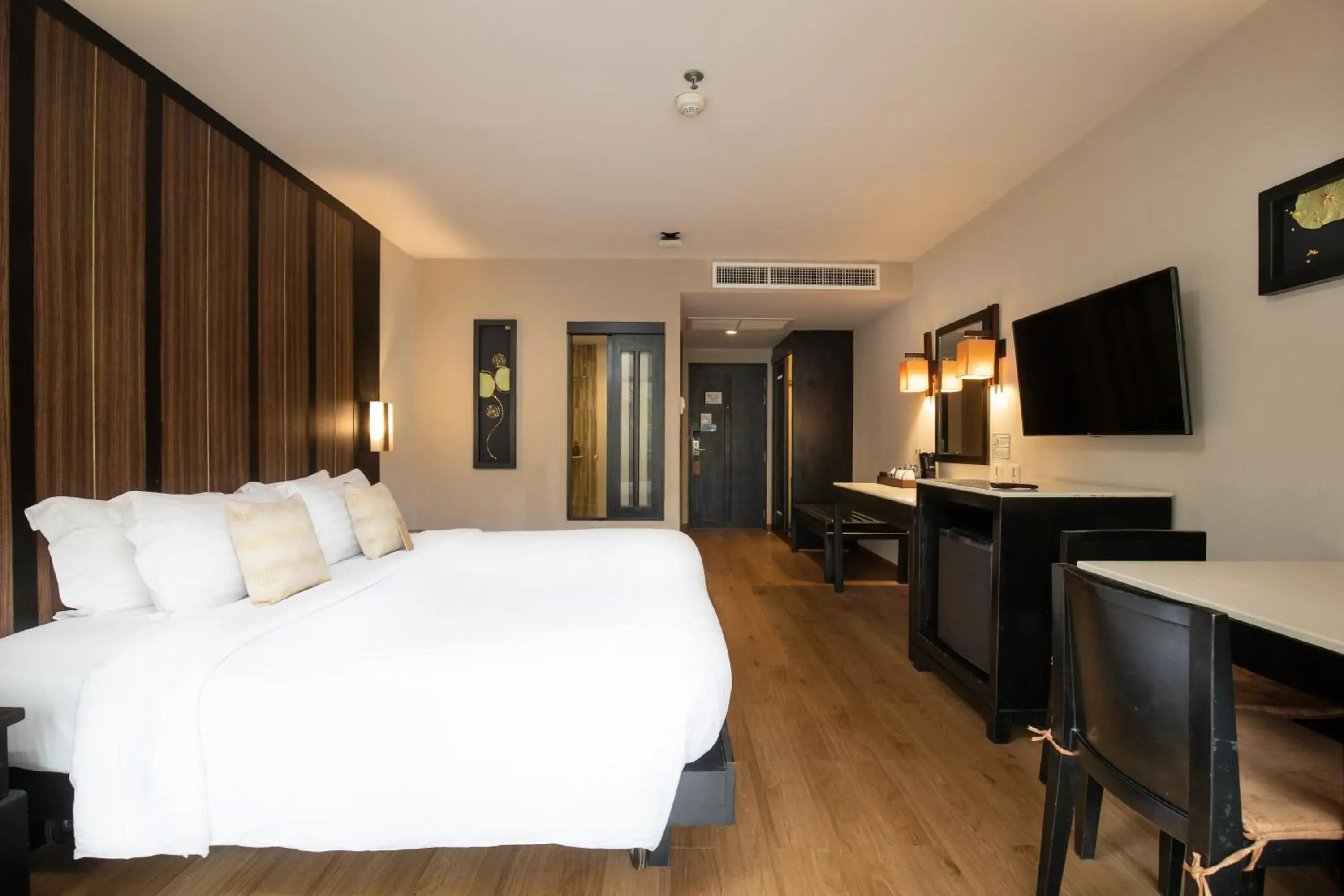 Communal lounge/ TV room, Bed in Deevana Patong Resort & Spa Communal lounge/ TV room, Bed in Deevana Patong Resort & Spa