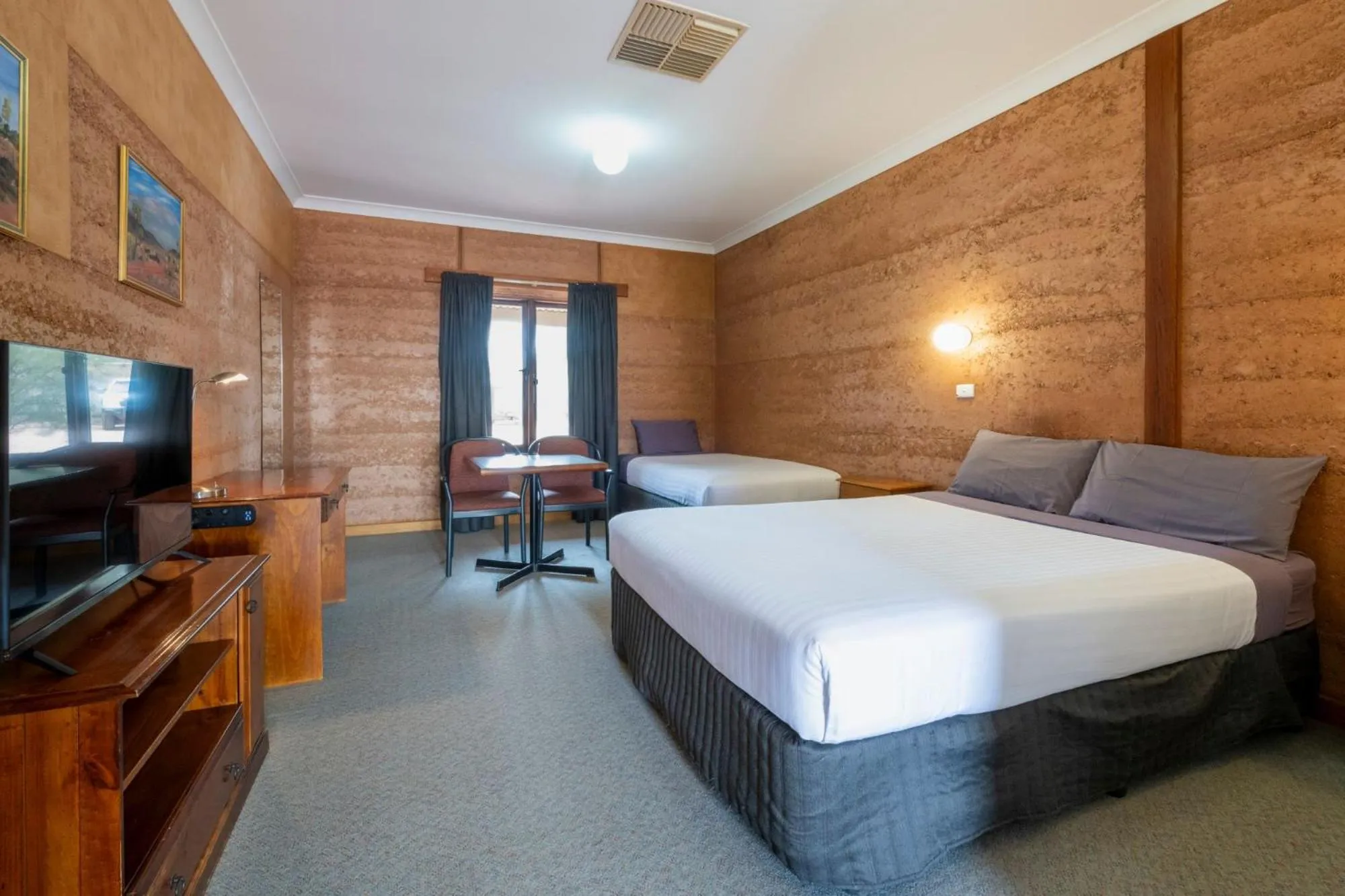 Photo of the whole room, Bed in Mud Hut Motel