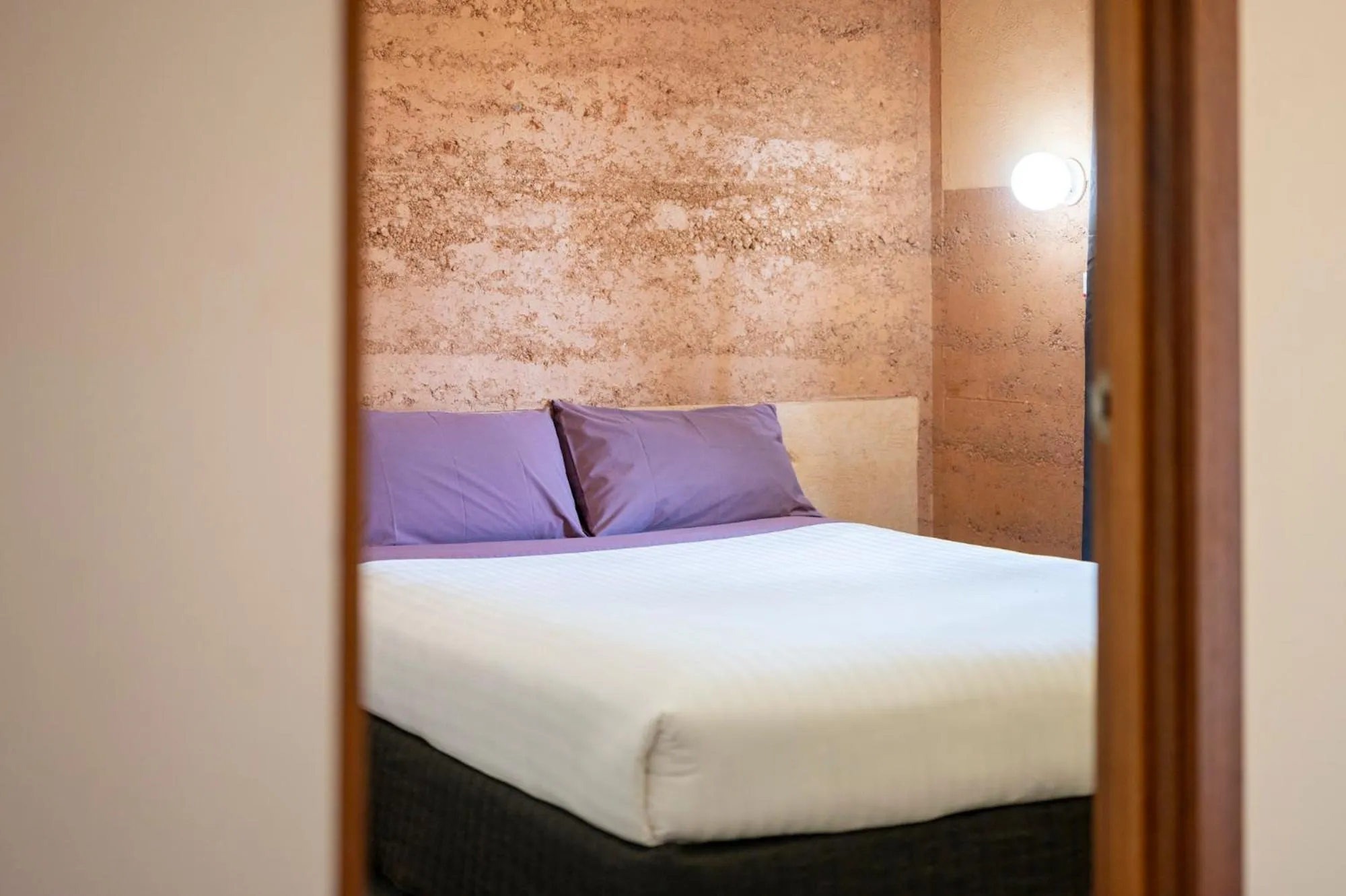 Bedroom, Bed in Mud Hut Motel