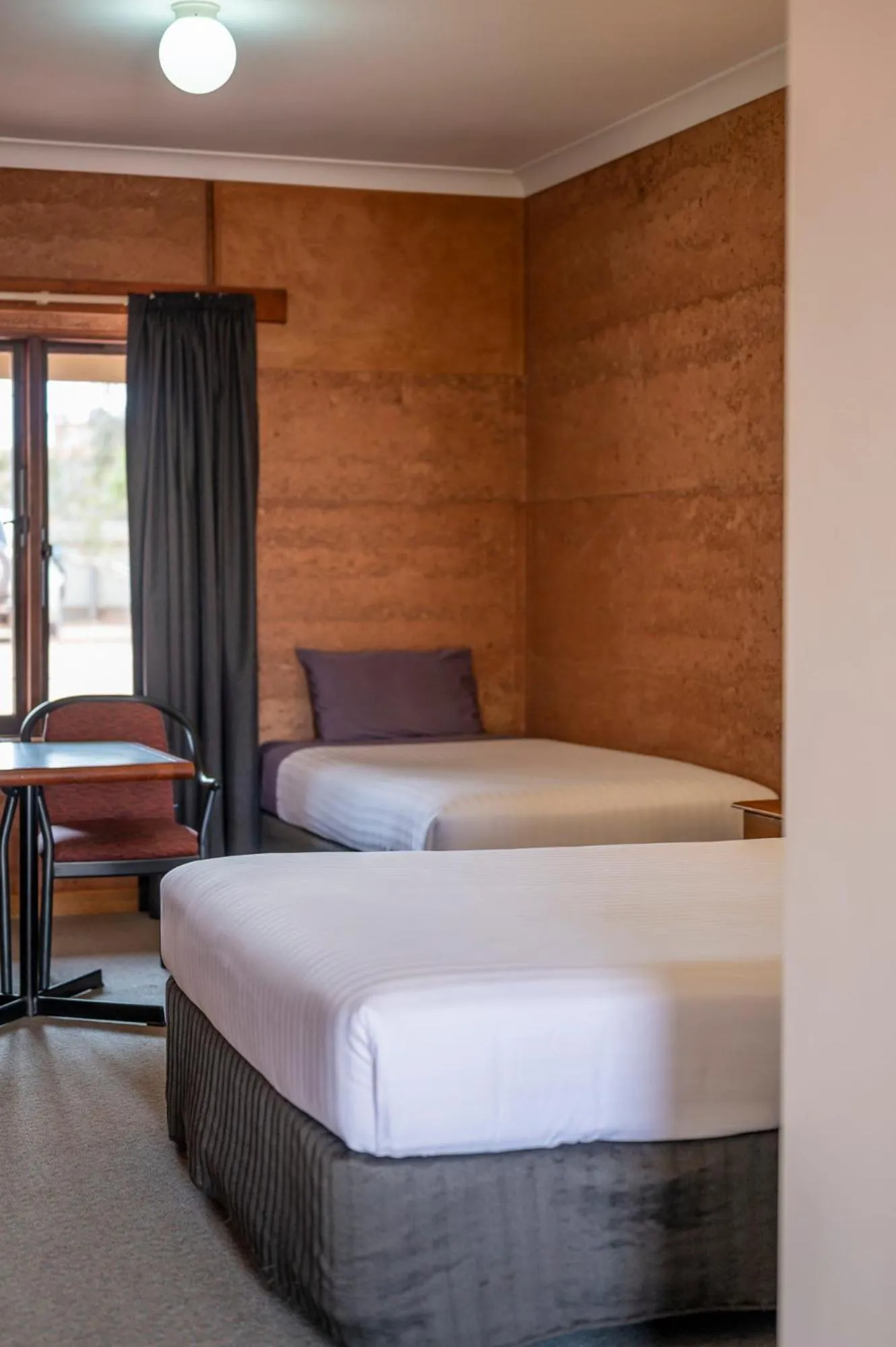 Bedroom, Bed in Mud Hut Motel