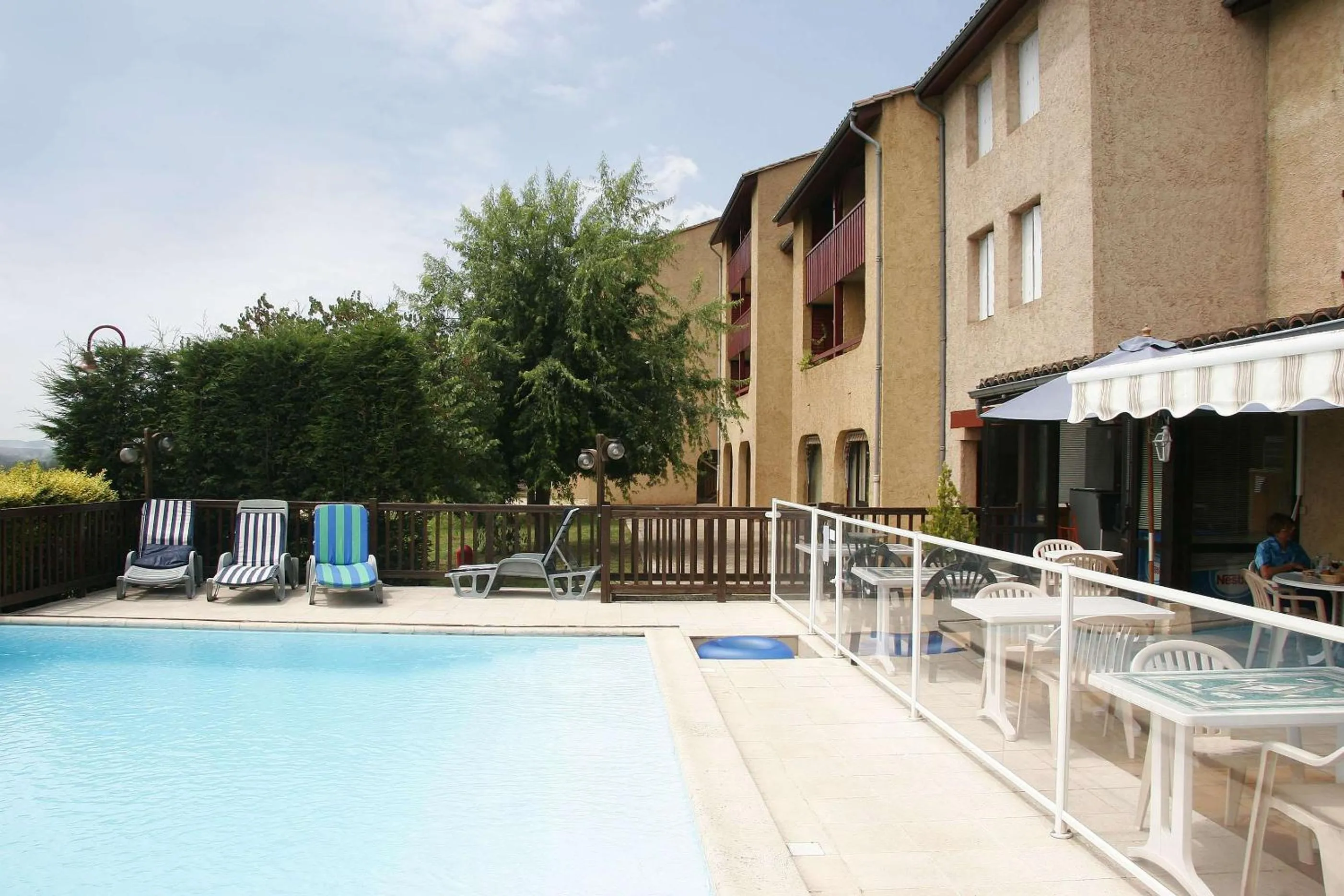 Pool view in Brit Hotel Vallee du Lot