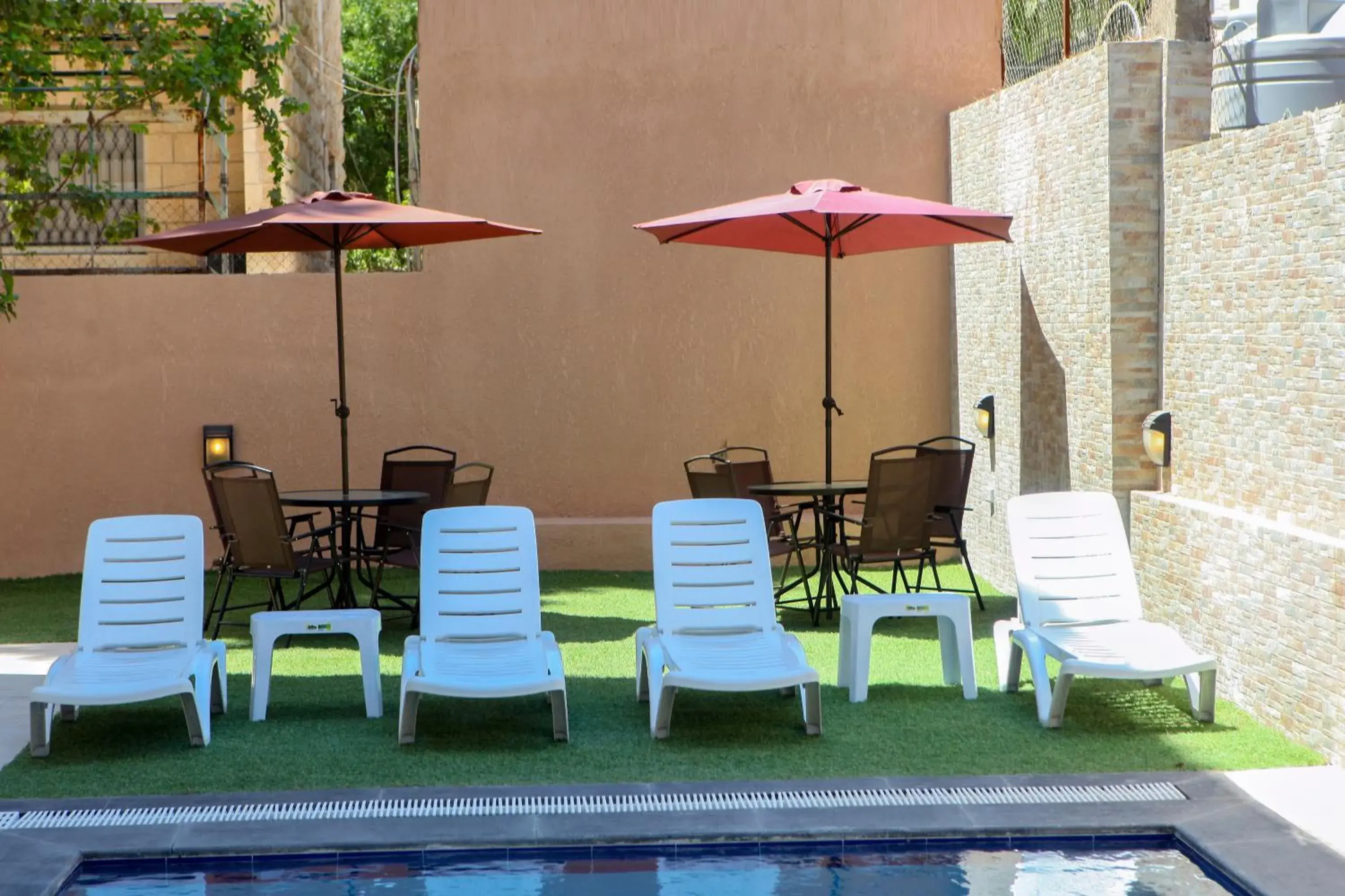 Swimming pool in Almond Hotel Apartments