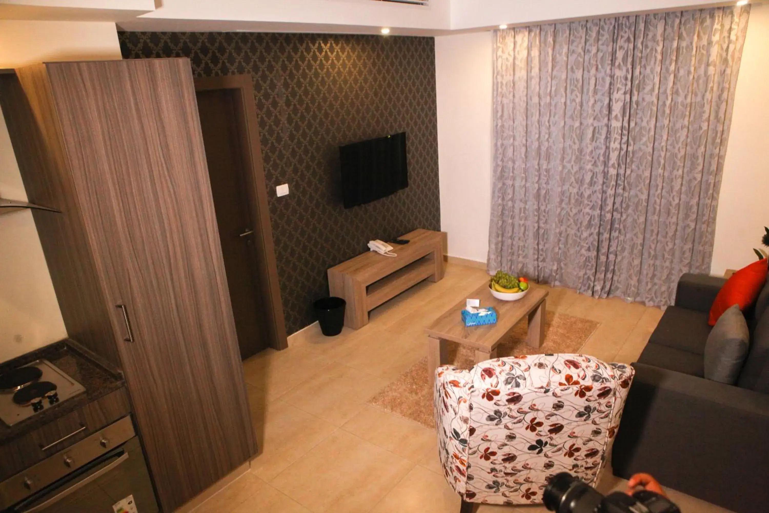 Living room, TV/Entertainment Center in Almond Hotel Apartments