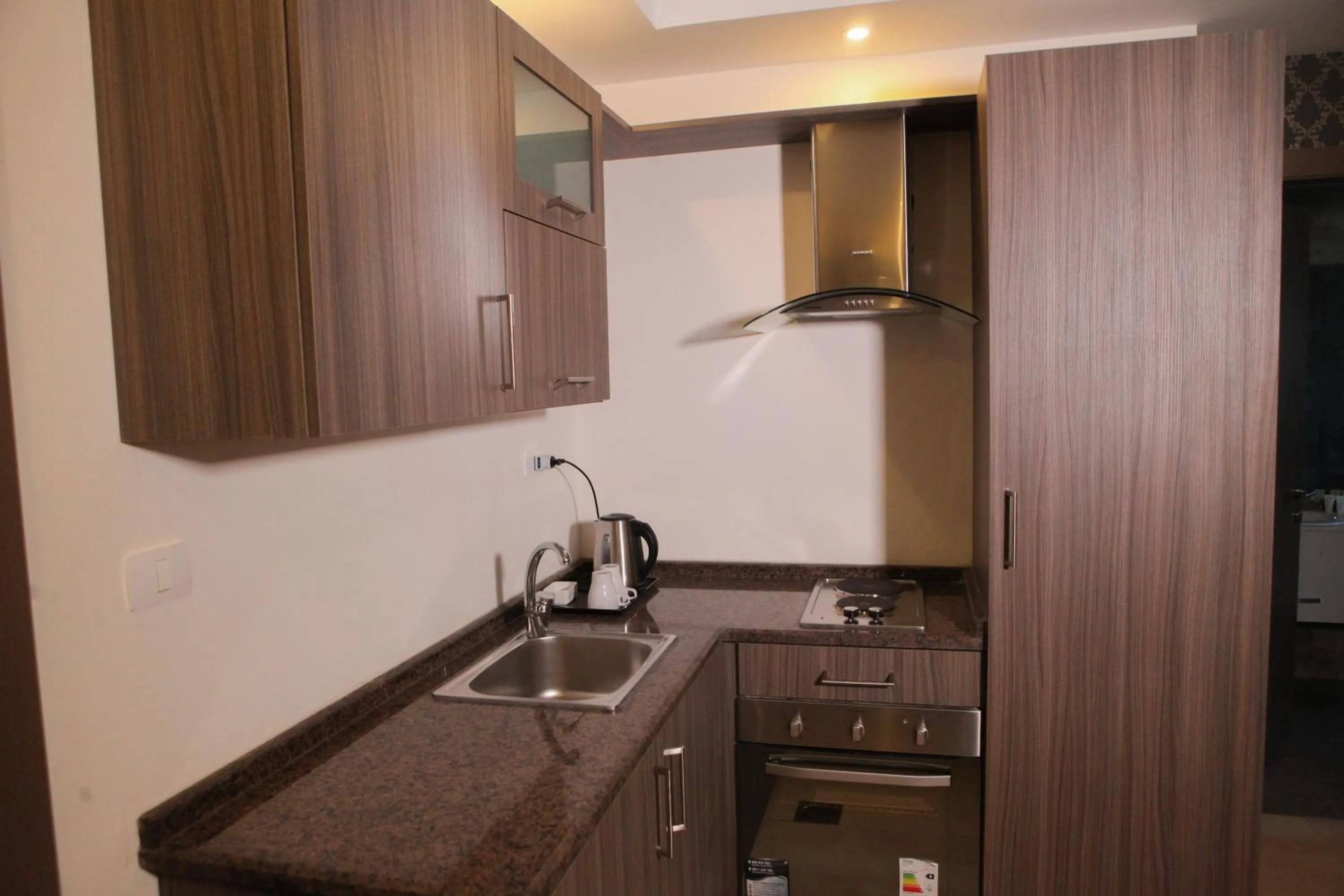 Kitchen or kitchenette in Almond Hotel Apartments
