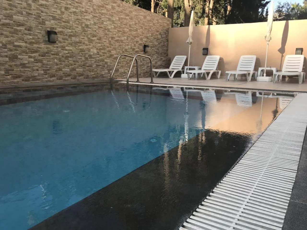 Swimming pool in Almond Hotel Apartments
