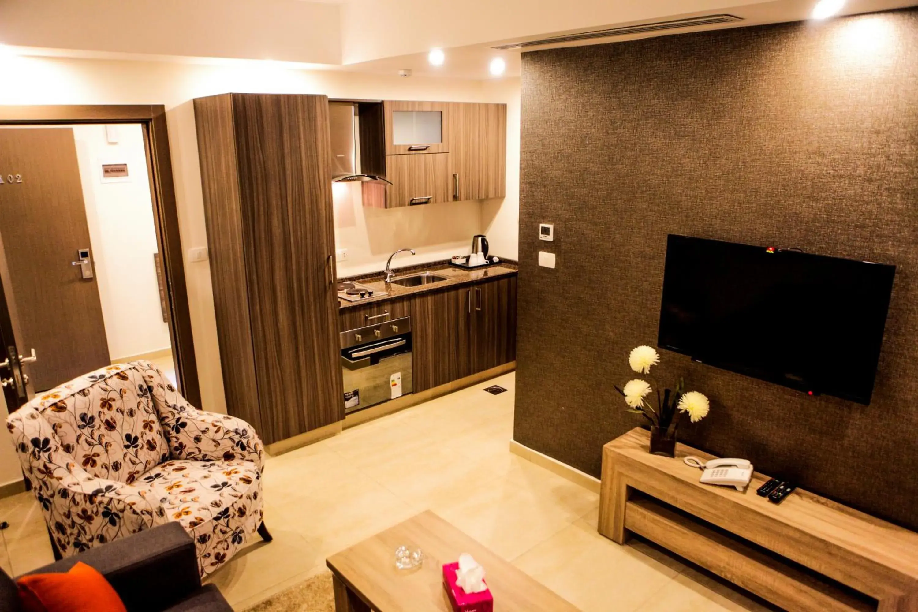 Seating area, TV/Entertainment Center in Almond Hotel Apartments