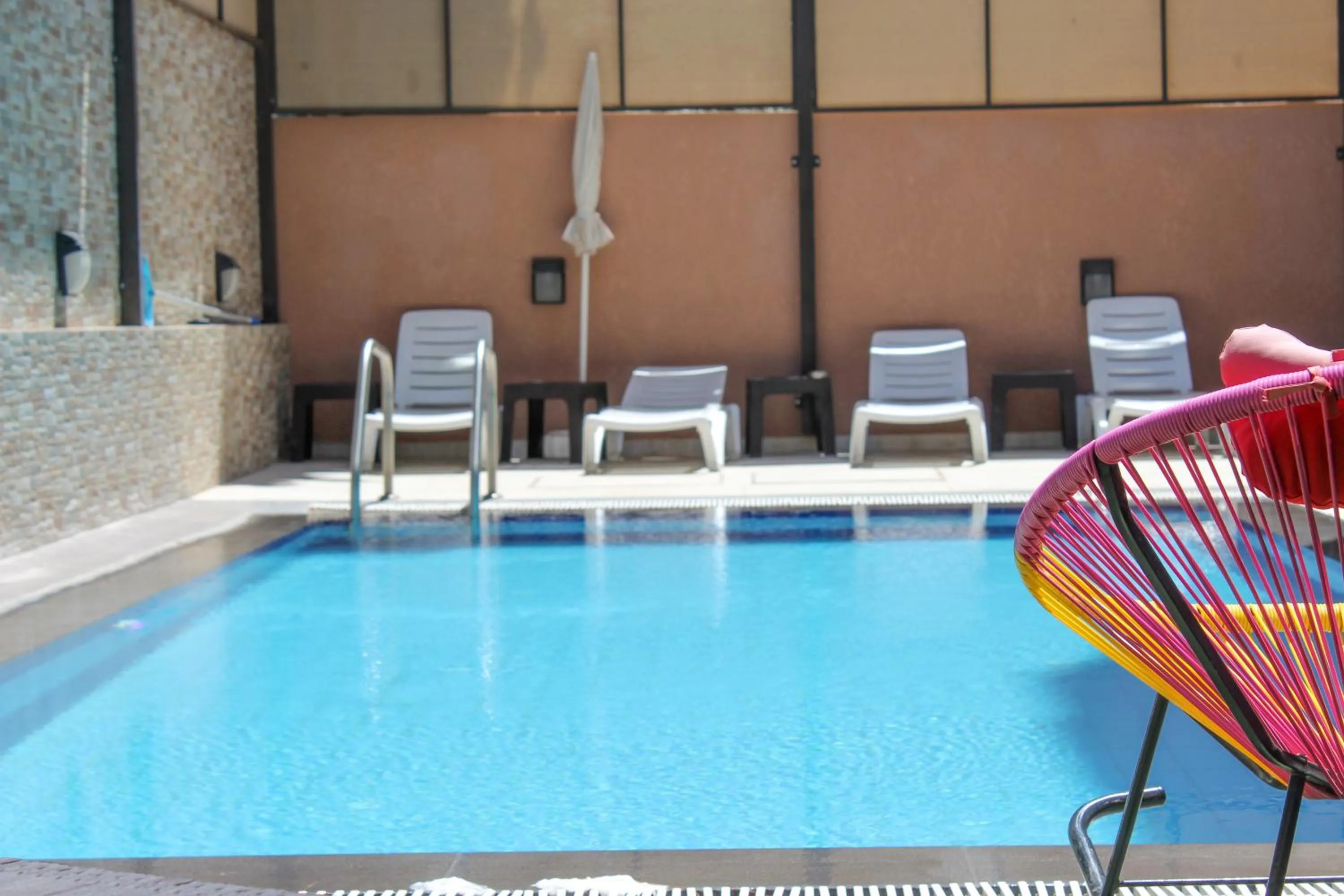 Swimming pool in Almond Hotel Apartments