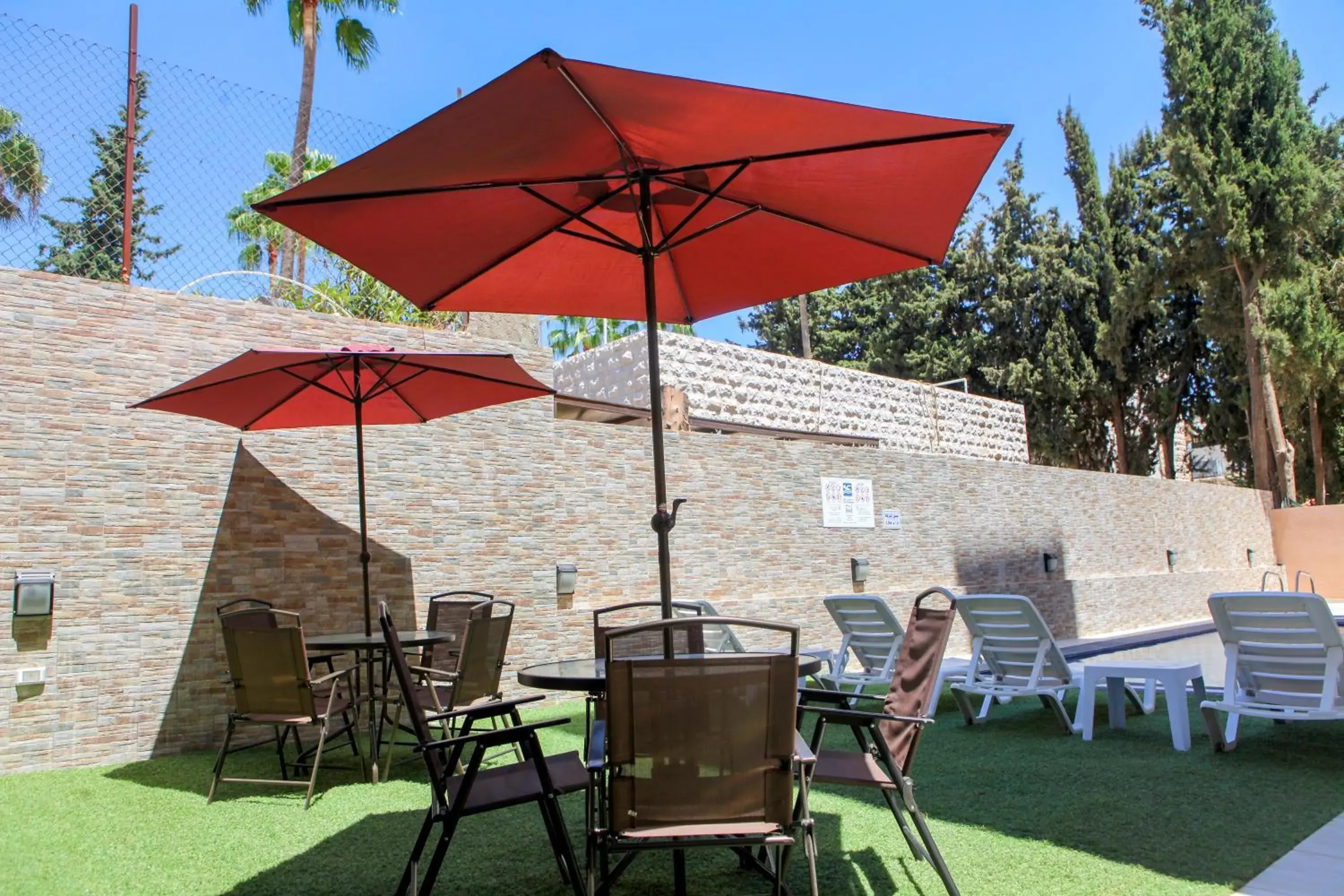 Swimming pool in Almond Hotel Apartments