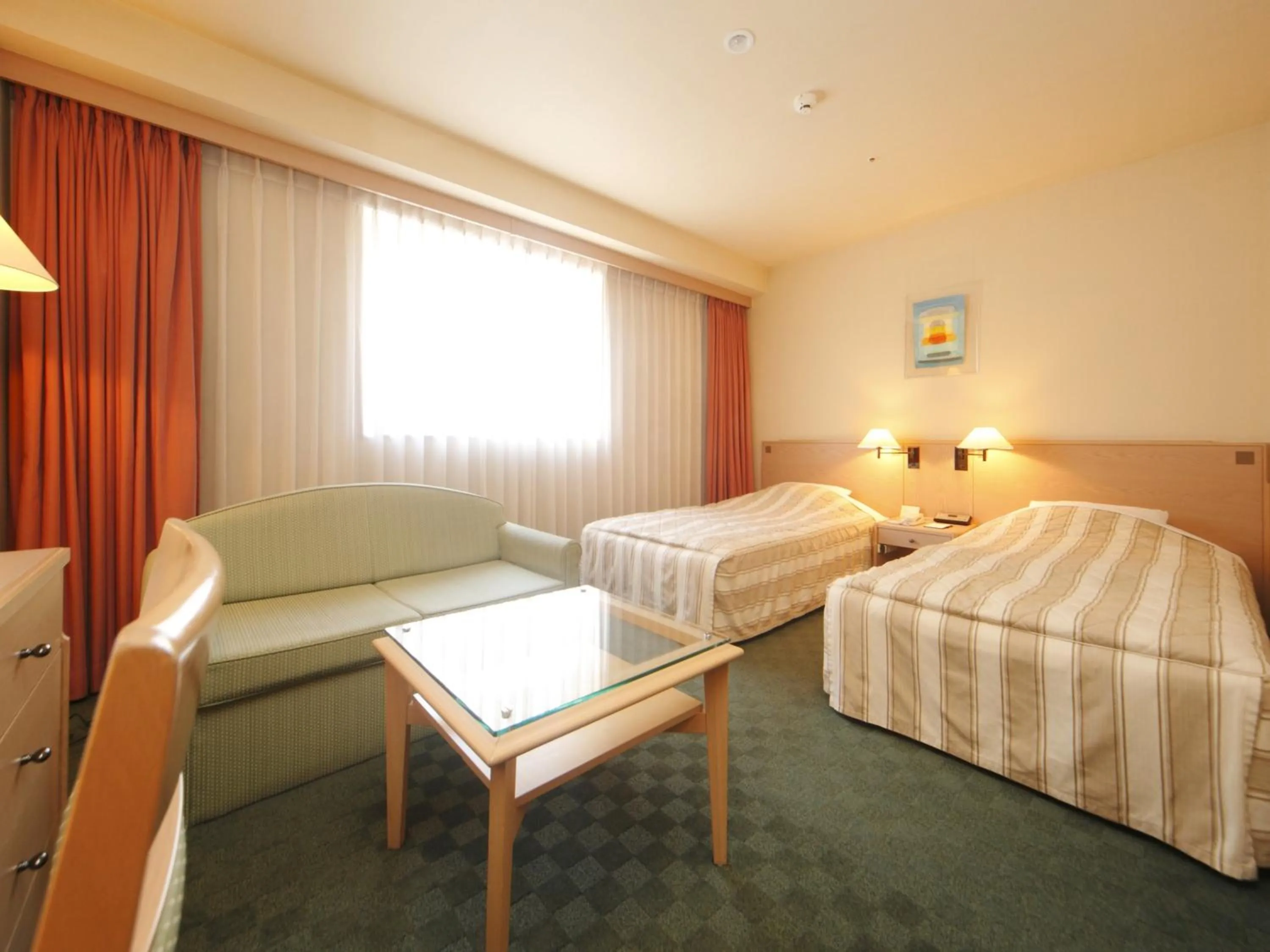 Bed in Jasmac Plaza Hotel