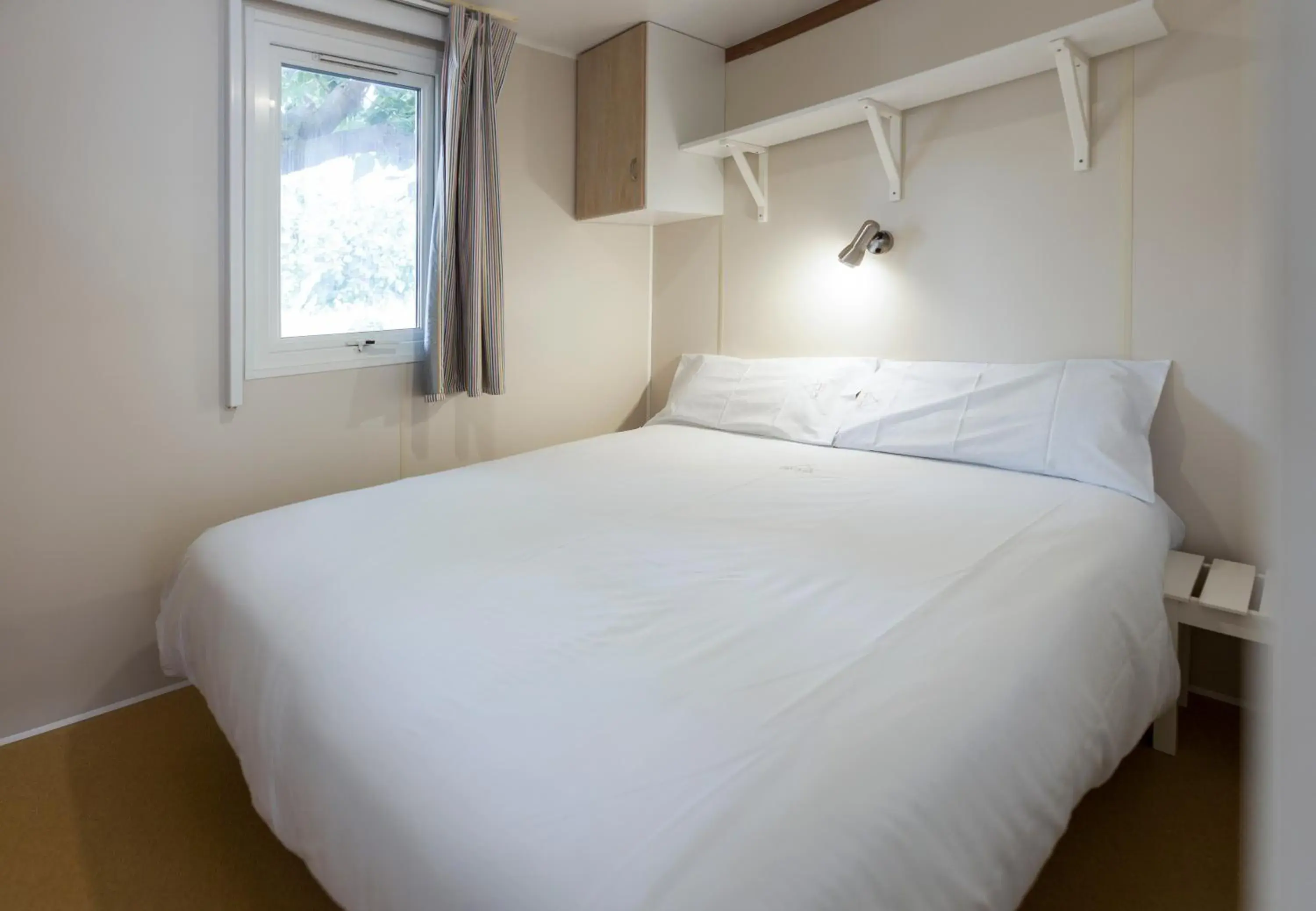 Bed in Camping Platja Cambrils Bed in Camping Platja Cambrils